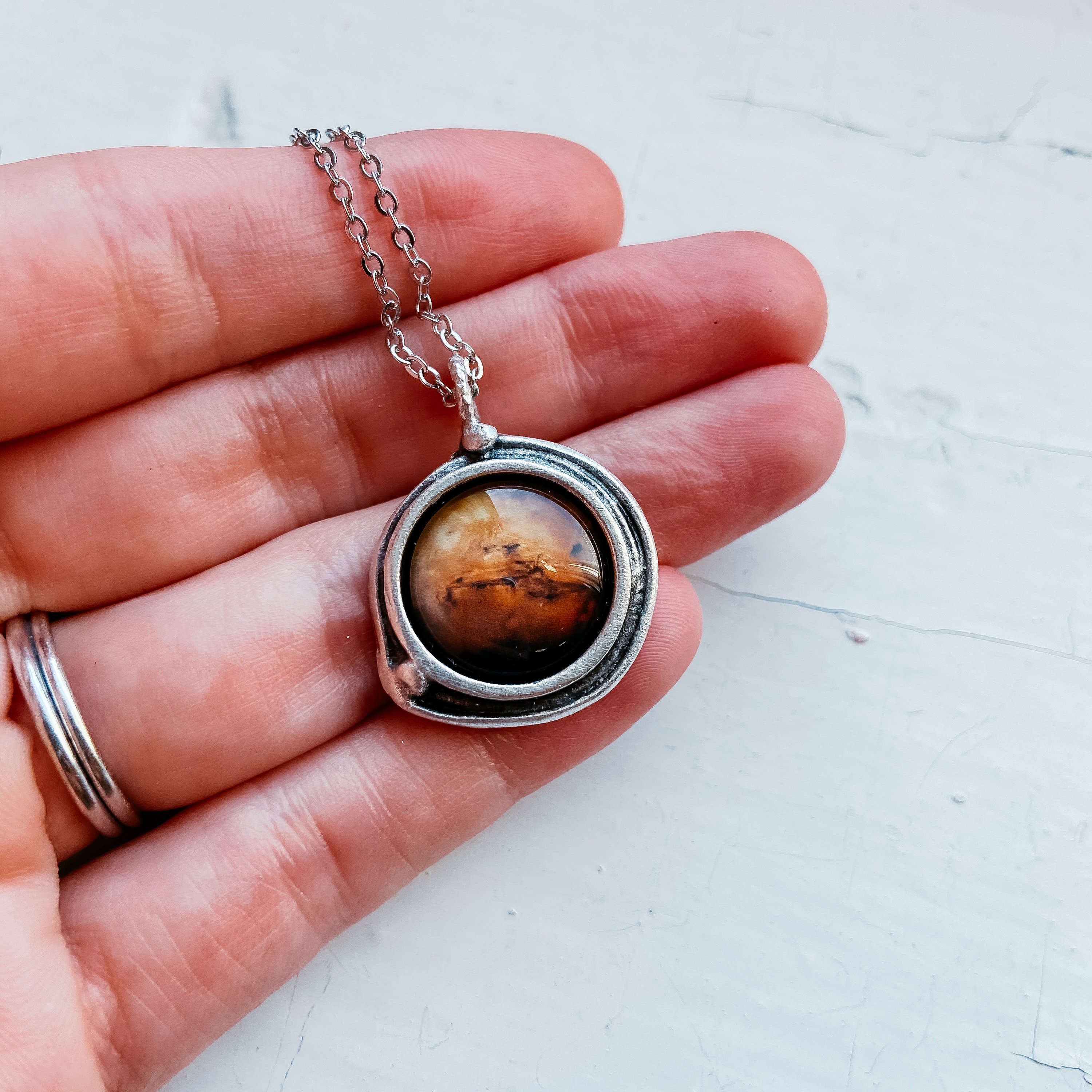 Handcrafted Mars and Moons Pendant Necklace featuring a silver tone Mars and orbiting beads representing Deimos and Phobos.