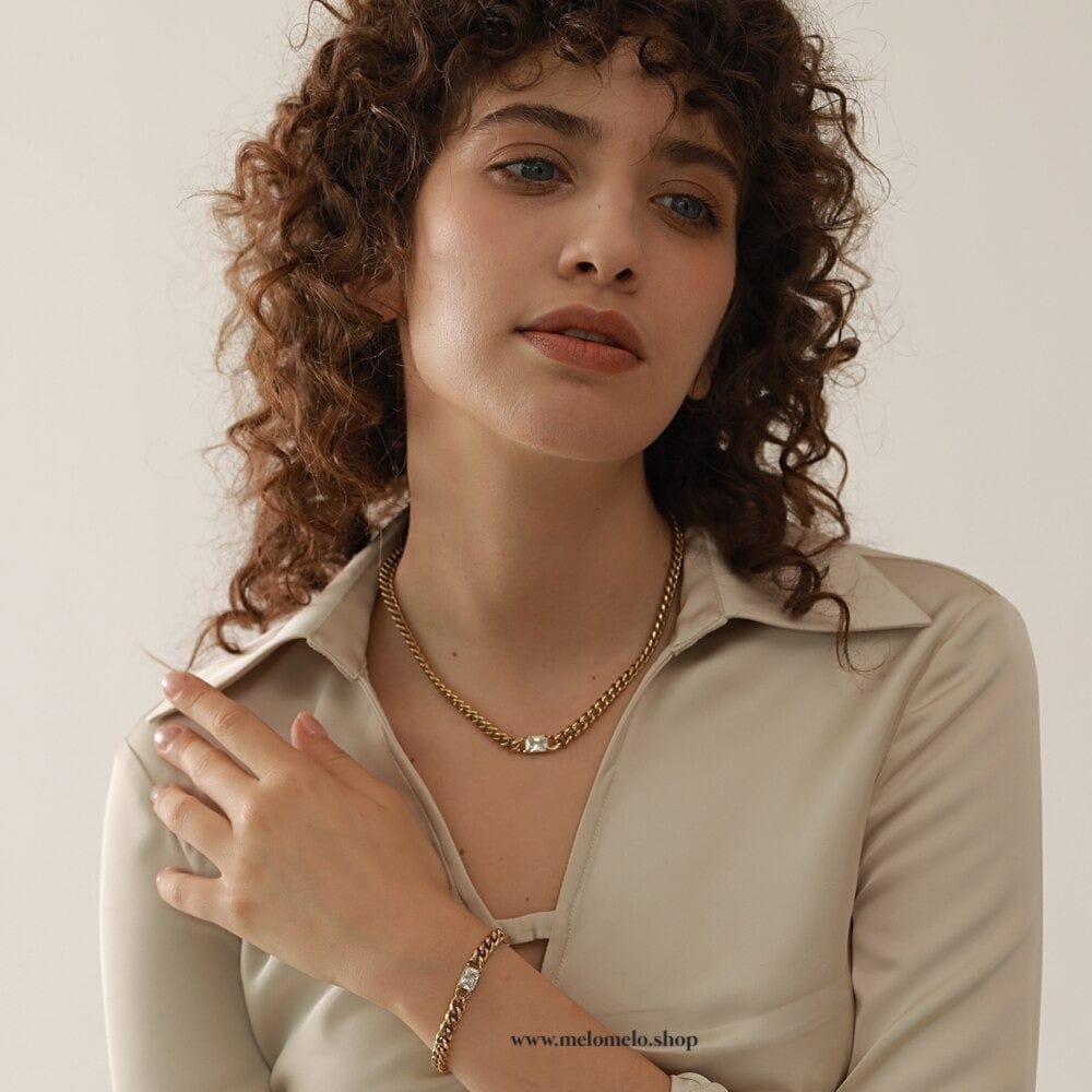 Martha Cuban Link Chain 8mm in rich gold with diamond cut emerald and clear CZ crystals, showcasing its chunky design and adjustable length.