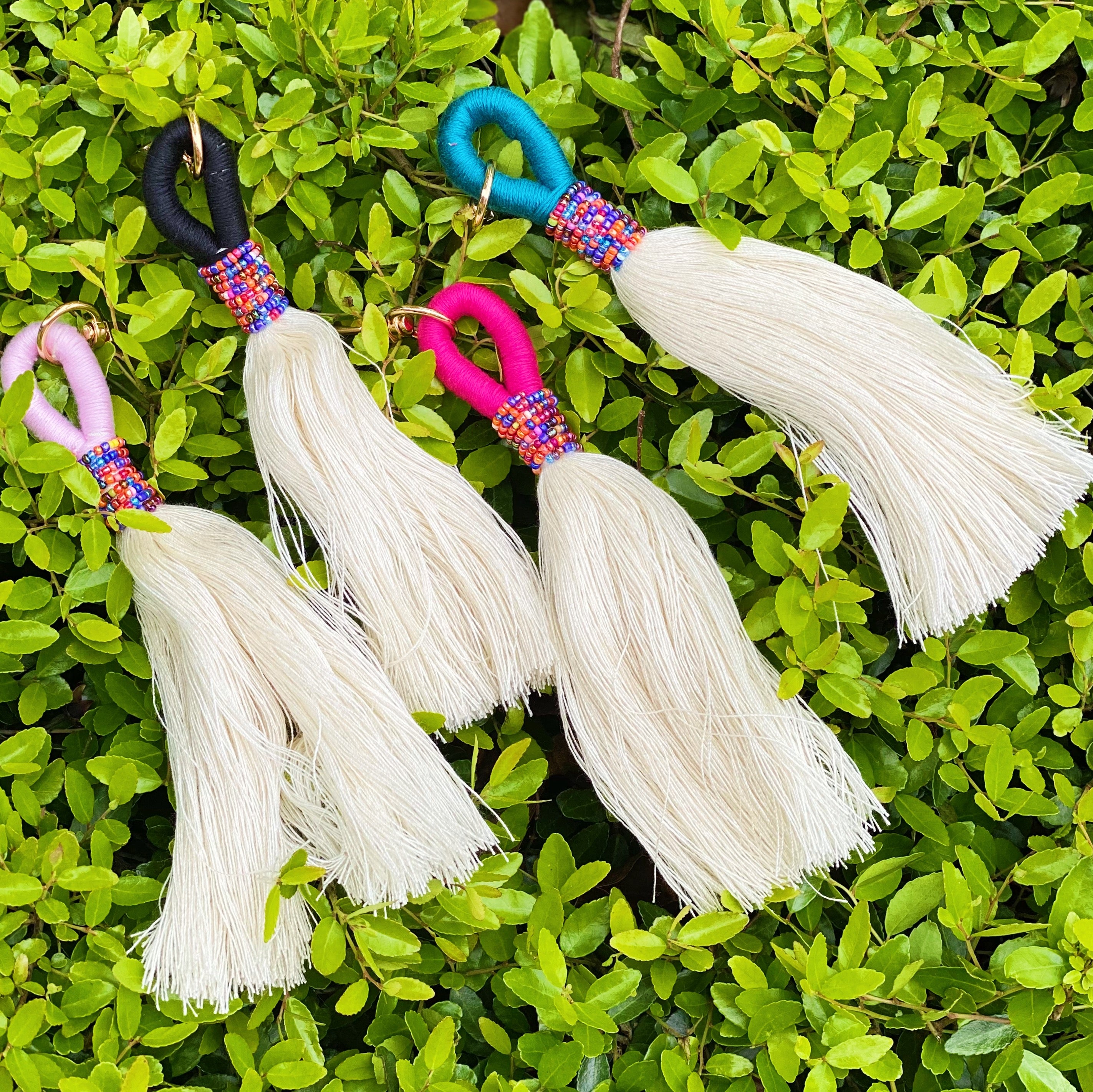 Maya Bay Tasseled Key Chain featuring vibrant jewel beads and colorful tassels with gold hardware.