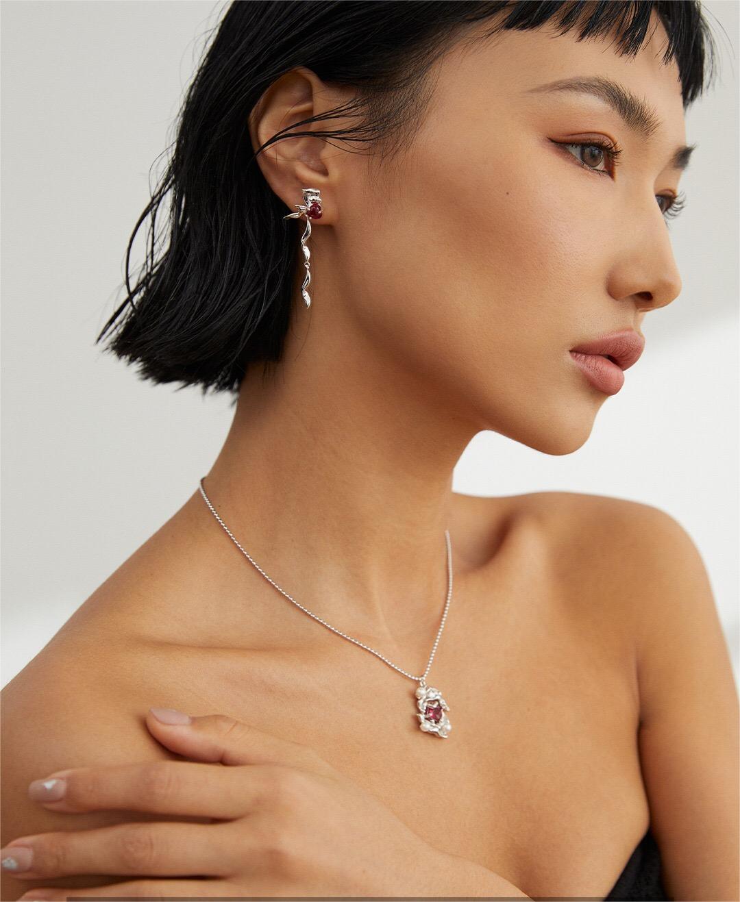 A beautiful Melting Liquid Design Pink Zircon Necklace featuring pink zircon stones set in gold vermeil, showcasing elegance and craftsmanship.