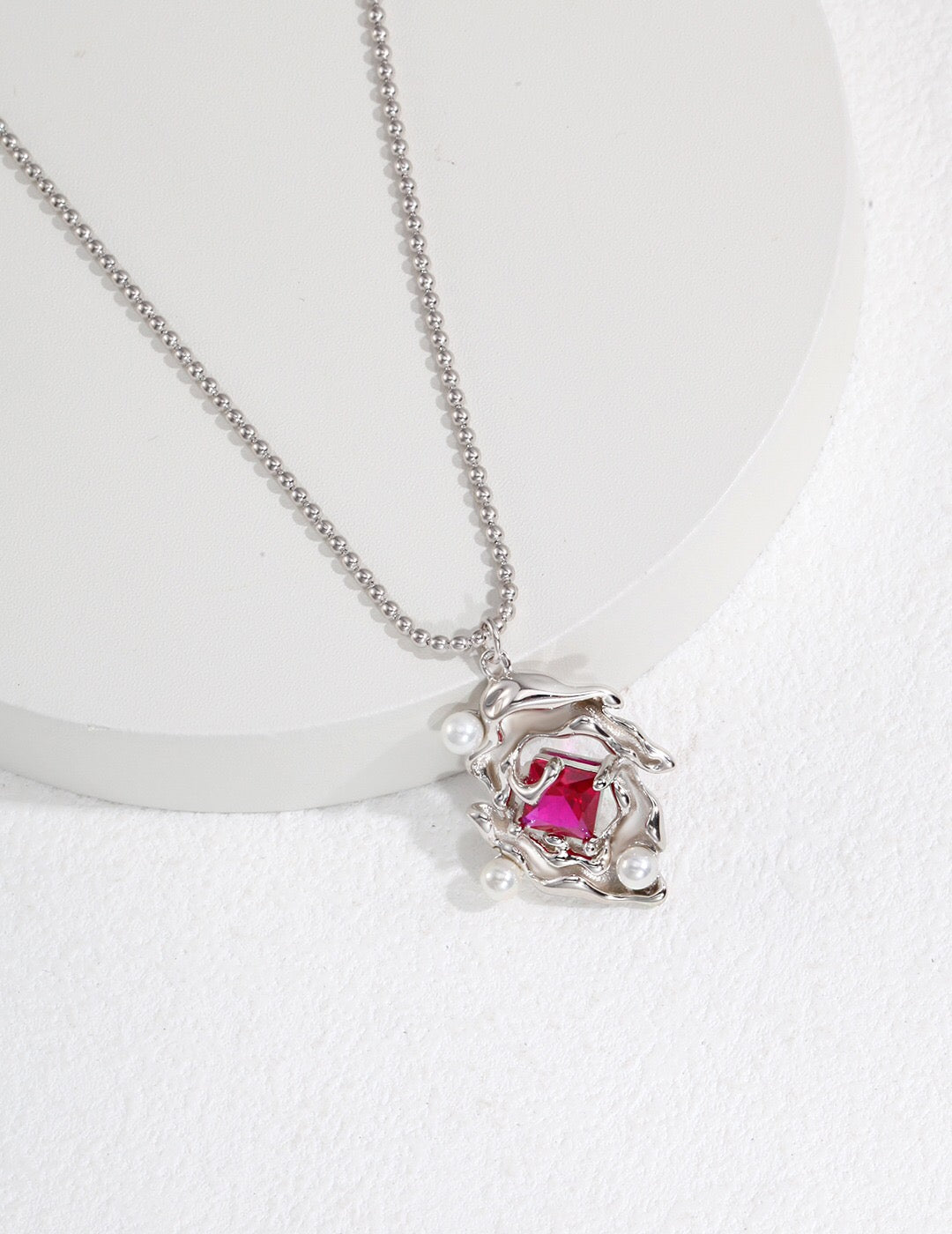 A beautiful Melting Liquid Design Pink Zircon Necklace featuring pink zircon stones set in gold vermeil, showcasing elegance and craftsmanship.
