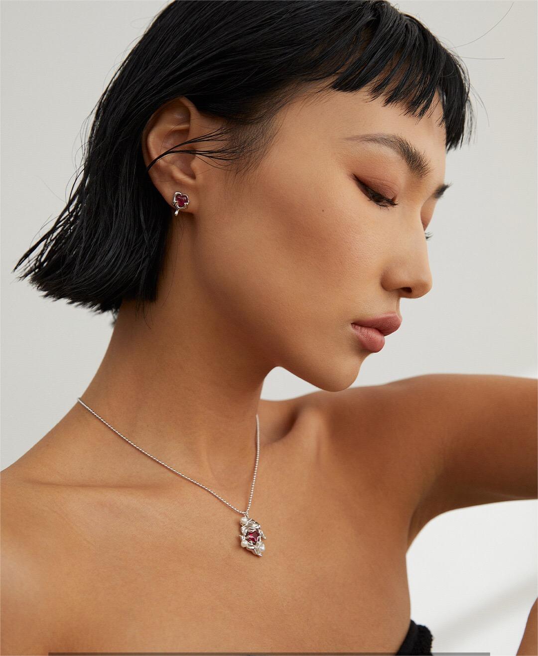 A beautiful Melting Liquid Design Pink Zircon Necklace featuring pink zircon stones set in gold vermeil, showcasing elegance and craftsmanship.
