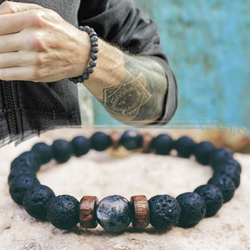 Men's bracelet featuring natural moonstone beads, Tibetan Buddha design, and lava stone accents, perfect for chakra healing.