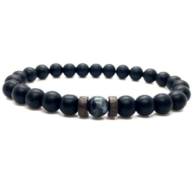 Men's bracelet featuring natural moonstone beads, Tibetan Buddha design, and lava stone accents, perfect for chakra healing.