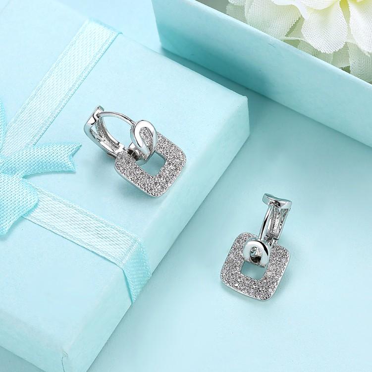Micro-Pav'e Crystal Square Shaped Earrings in 18K White Gold, featuring sparkling crystals and a butterfly backing for secure wear.