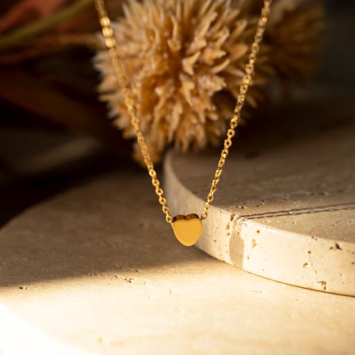 MINI Heart Necklace featuring a delicate heart pendant on a 14k gold plated stainless steel chain.
