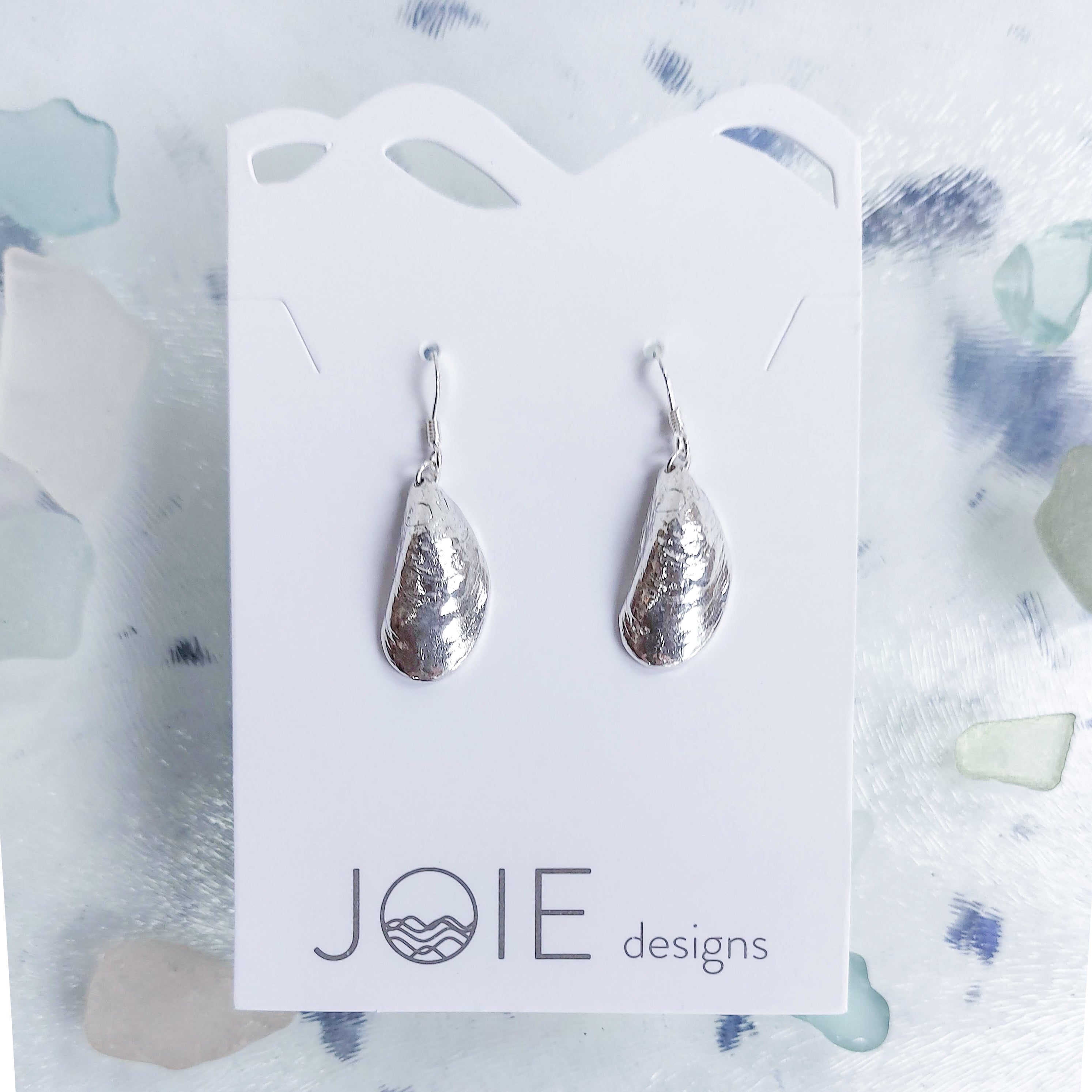 Mini Moanna Mussel Shell Earrings made from sterling silver, showcasing natural mussel shell designs.