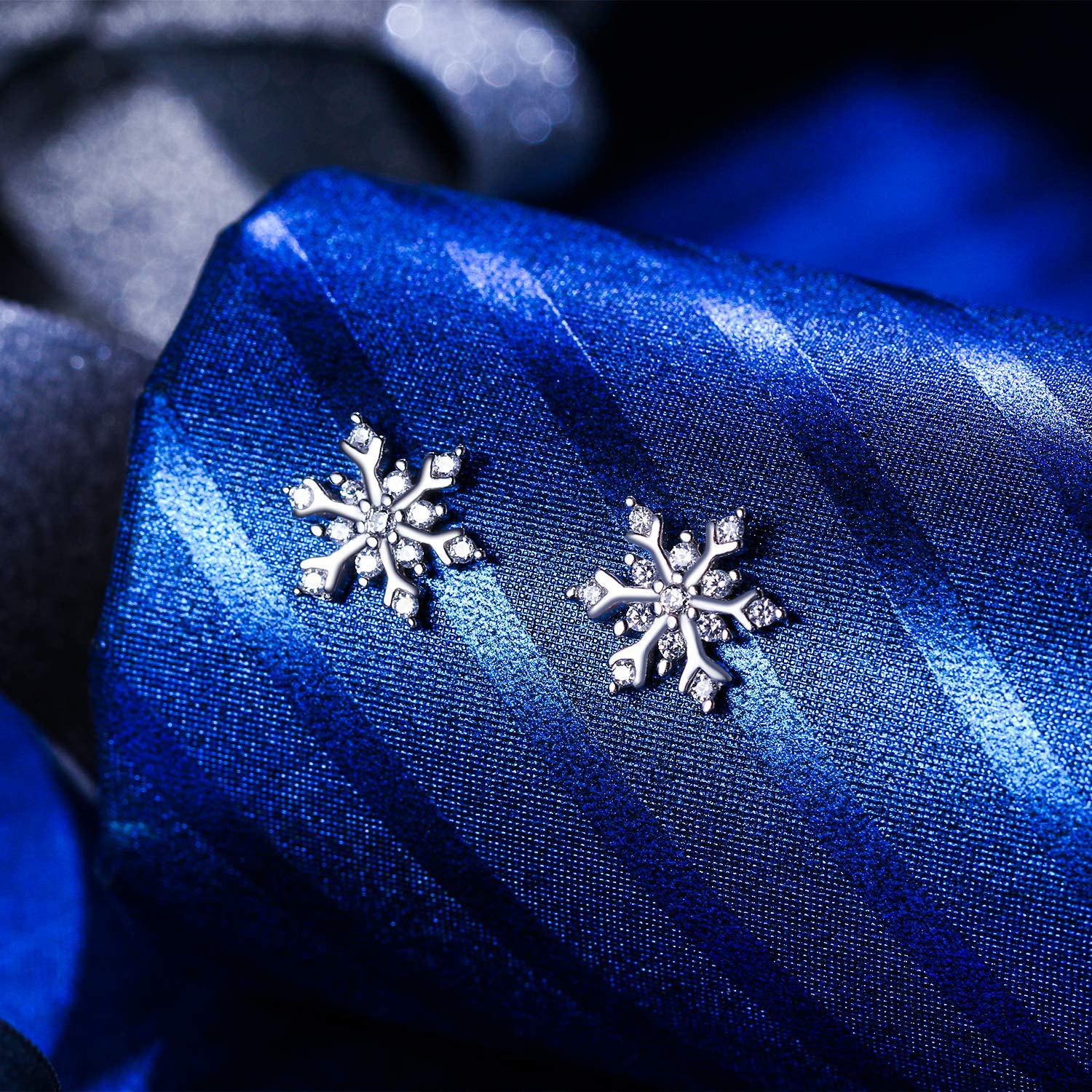 Elegant Mini White Crystal Aspen Snowflake Stud Earrings in 14K white gold plating with AAAAA princess-cut crystals.