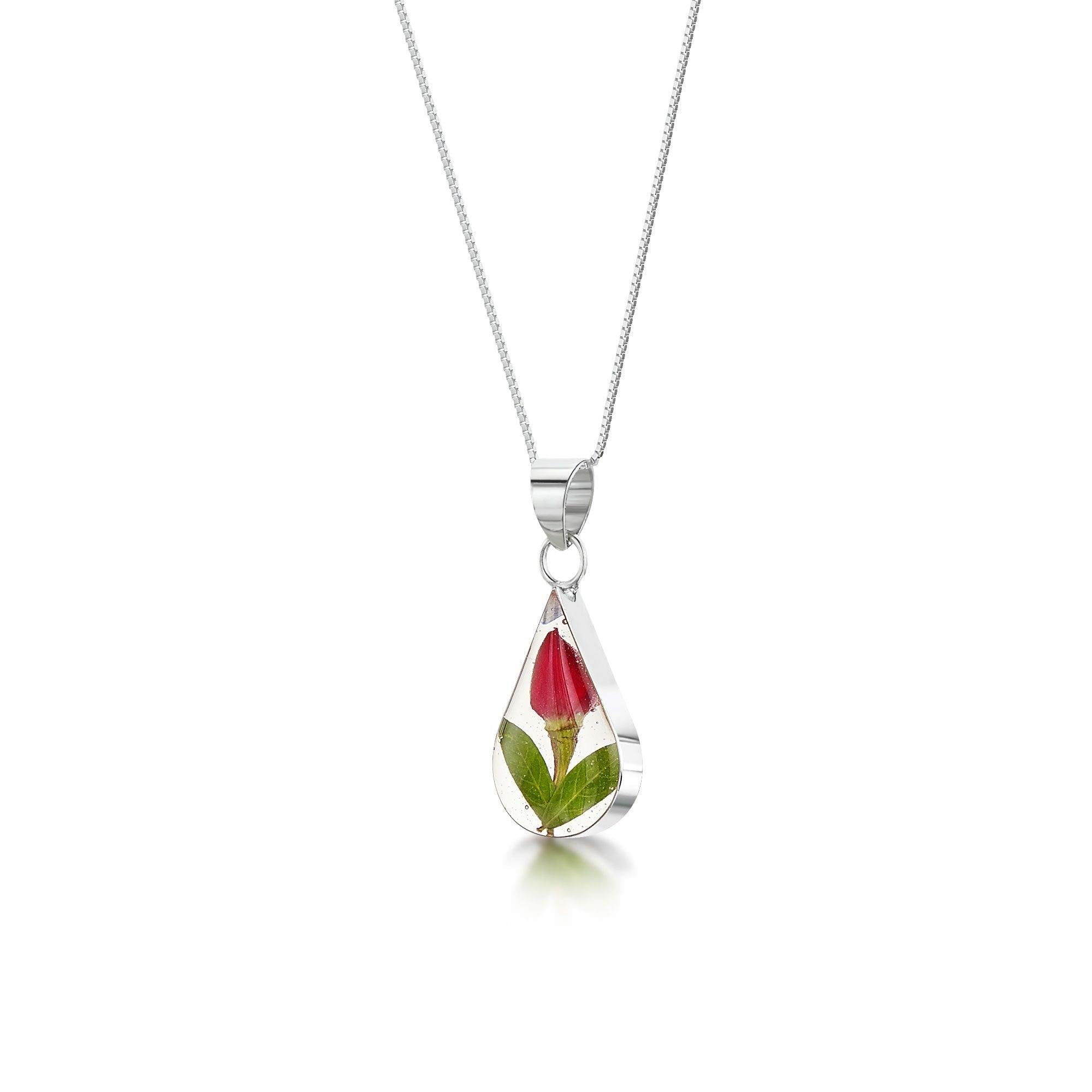 Miniature rose necklace featuring a sterling silver teardrop pendant and an adjustable chain, elegantly displayed in a gift box.