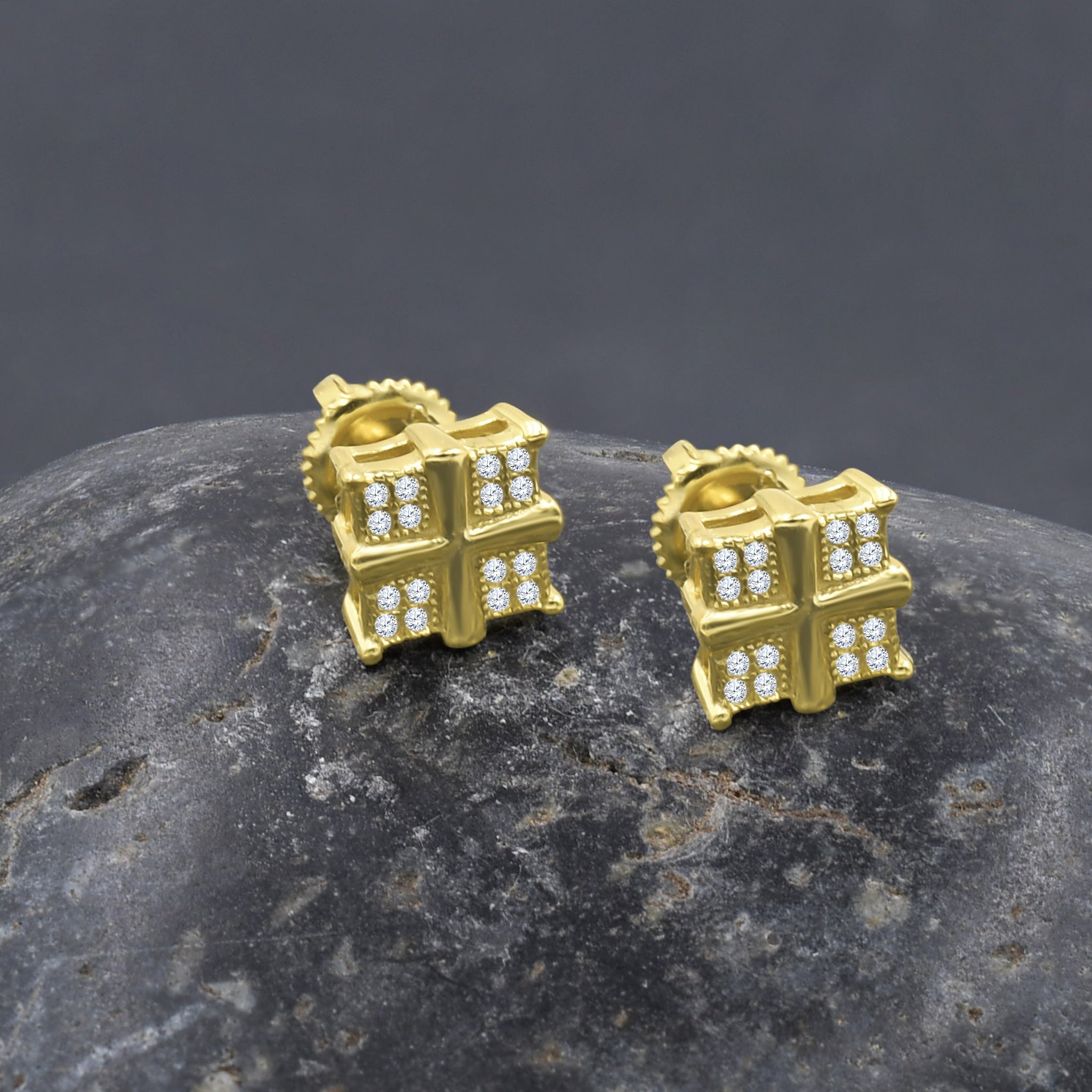 A pair of elegant miniature screw back earrings featuring sparkling cubic zirconia stones set in gold plated brass.