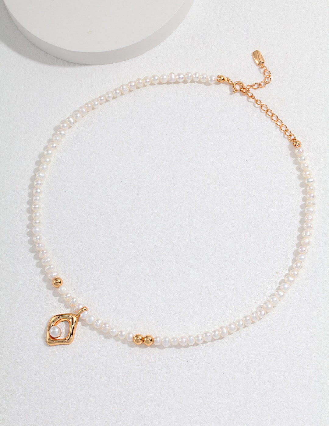 Minimalist Geometric Irregular Pendant Pearl Necklace featuring natural freshwater pearls and sterling silver with gold vermeil plating.