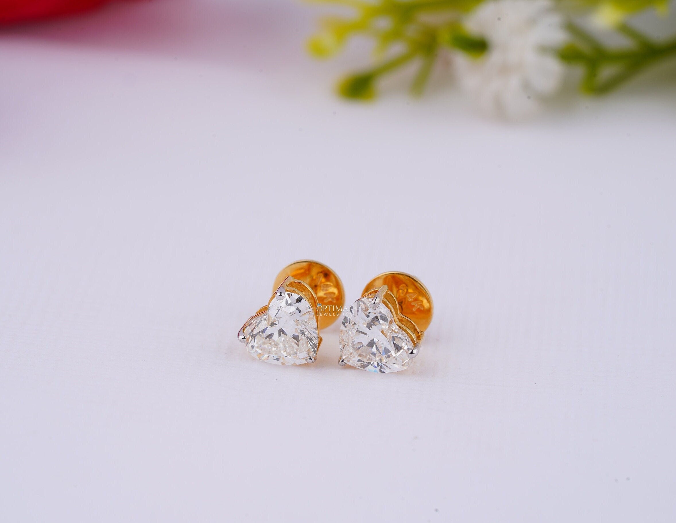 Minimalist heart shape diamond earrings featuring 1 Ctw heart cut lab-grown diamonds set in yellow gold, perfect for anniversaries.