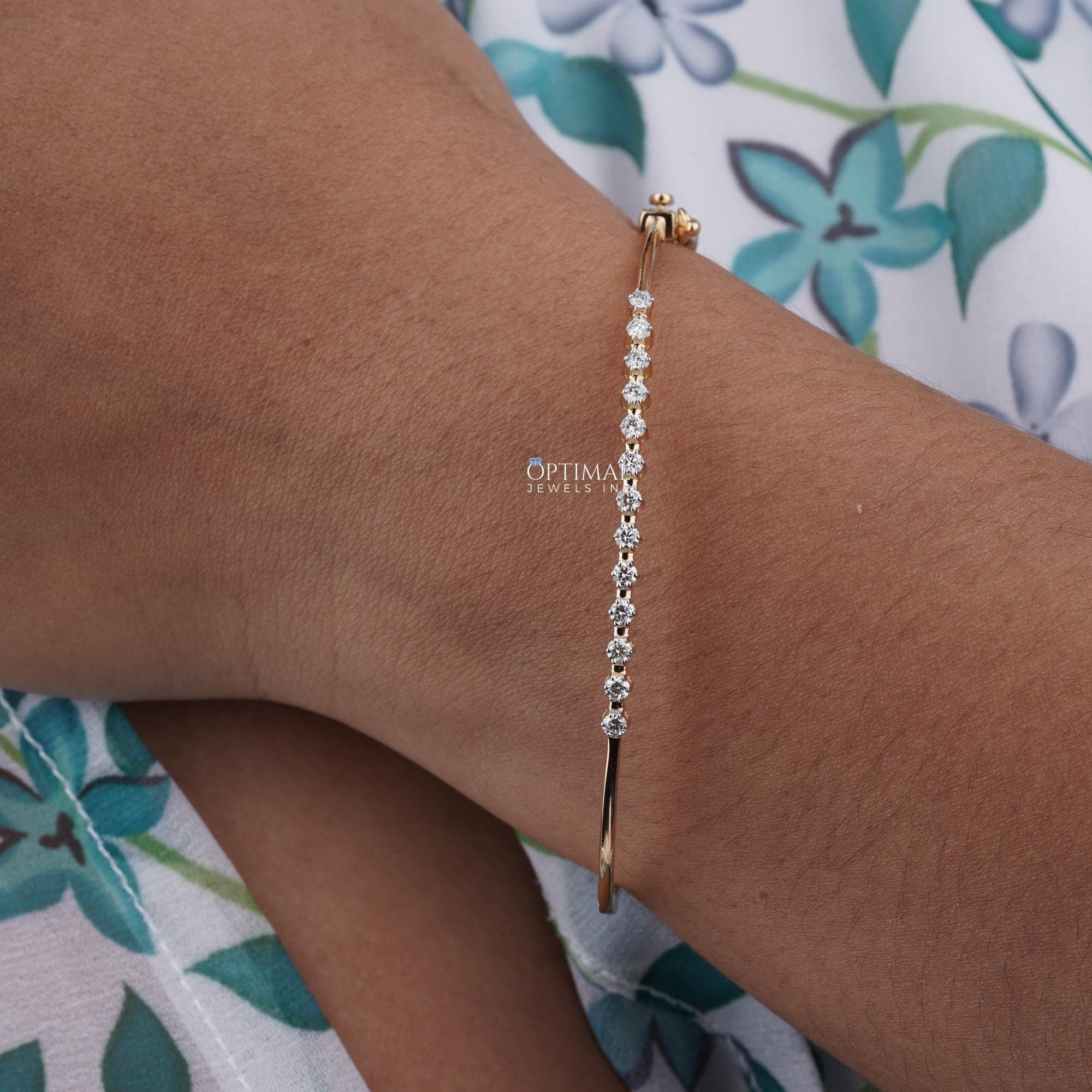 Minimalist Lab-Grown Diamond Bracelet featuring 0.80 CTW round cut diamonds set in 14K yellow gold, elegantly displayed.