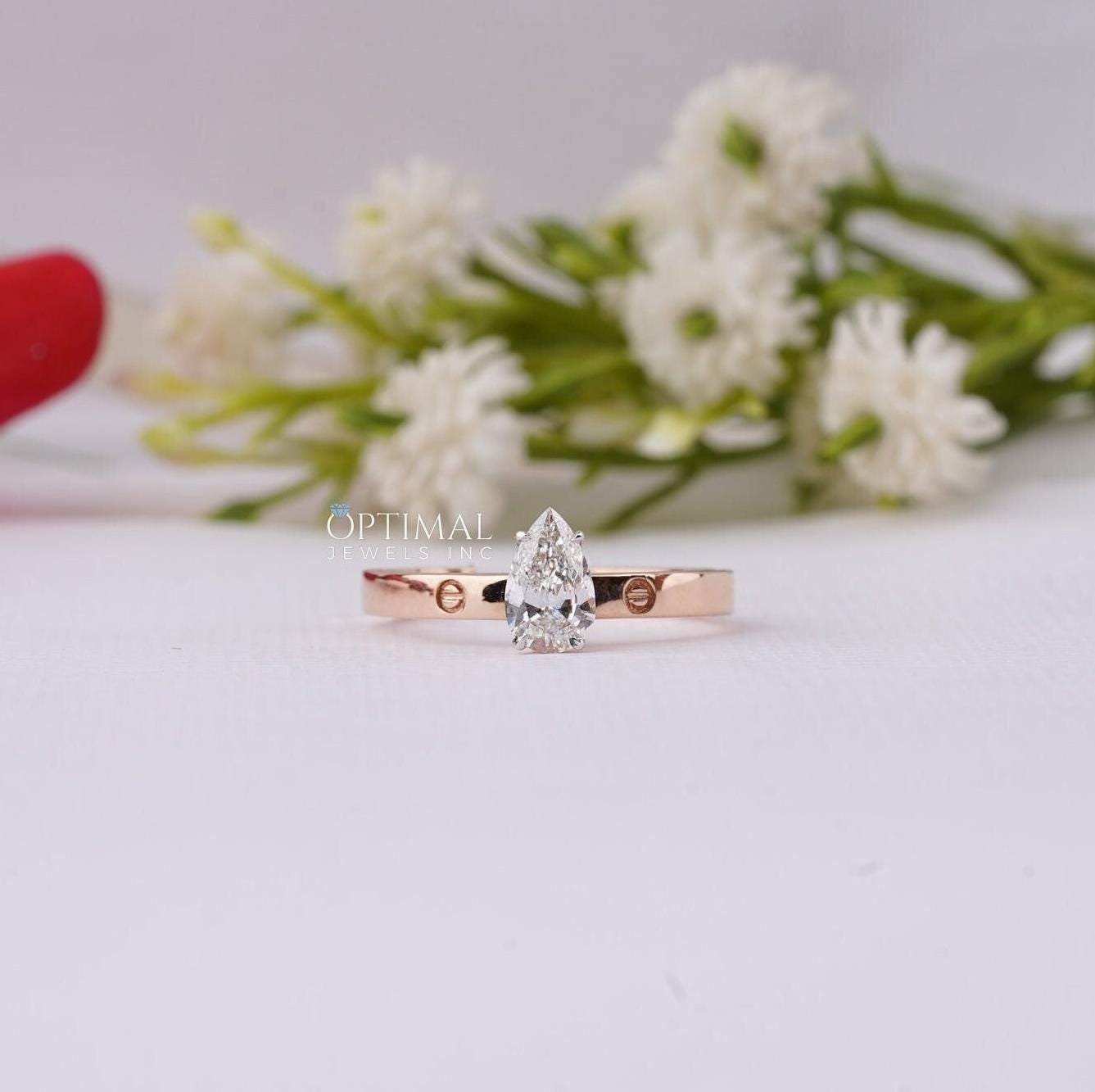 Minimalist Pear Lab Grown Diamond Engagement Ring featuring a 0.53 Ctw pear cut diamond set in a sleek band, perfect for everyday wear.