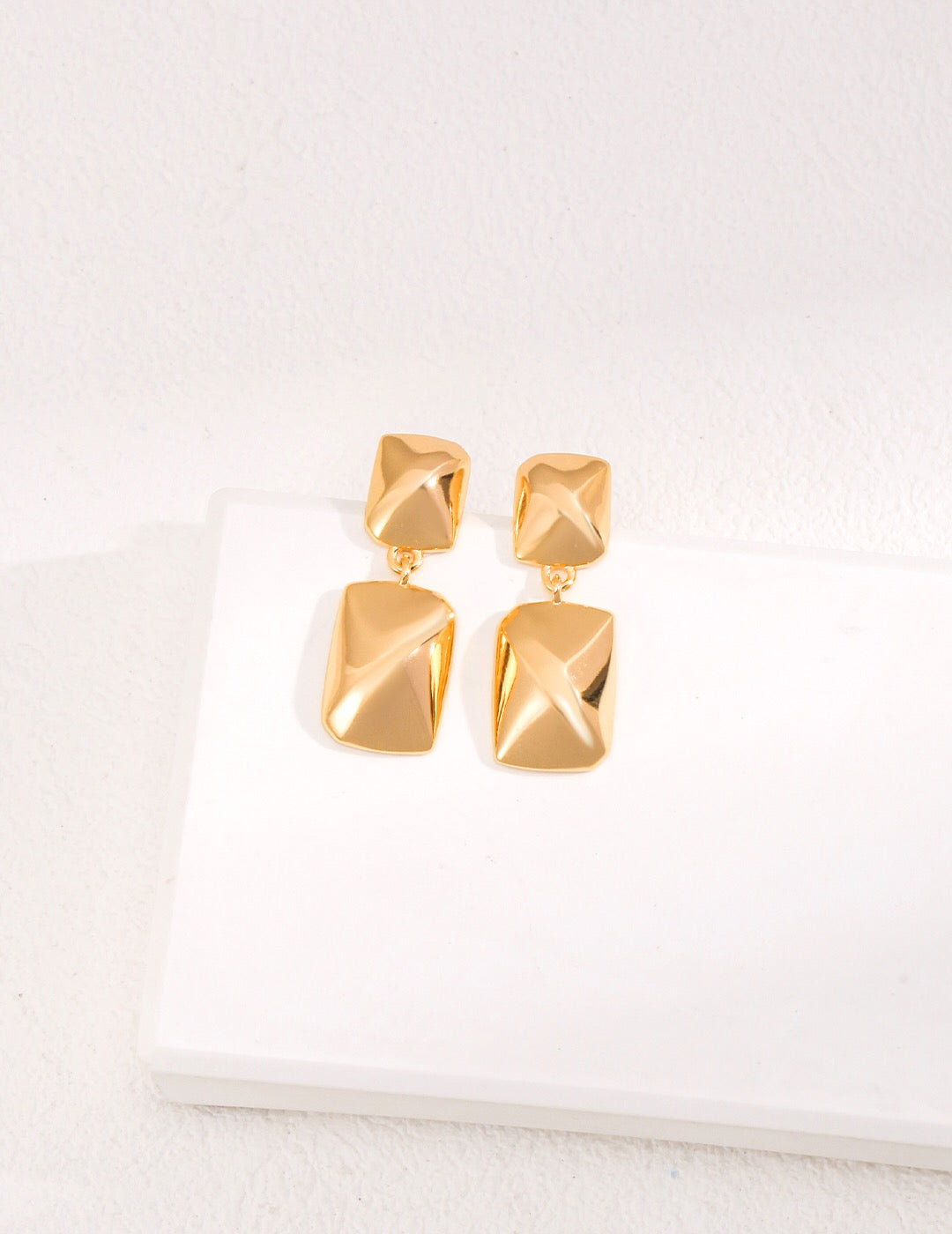 Minimalist rectangular shape earrings made of gold vermeil, showcasing a sleek and elegant design.