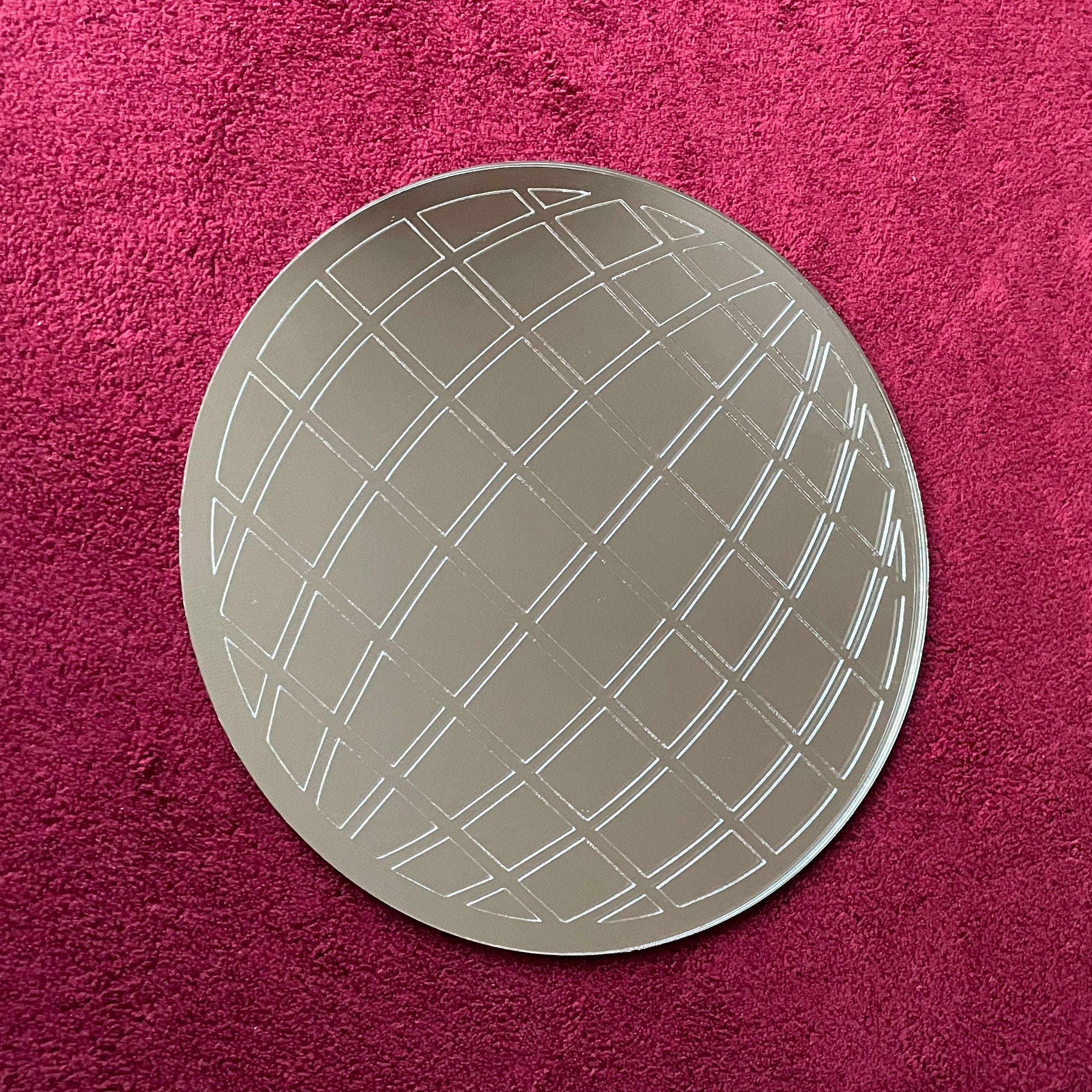 A stylish Mirror Ball Wall Hanging, 20cm in diameter, reflecting light with a vibrant color finish, perfect for home decor.