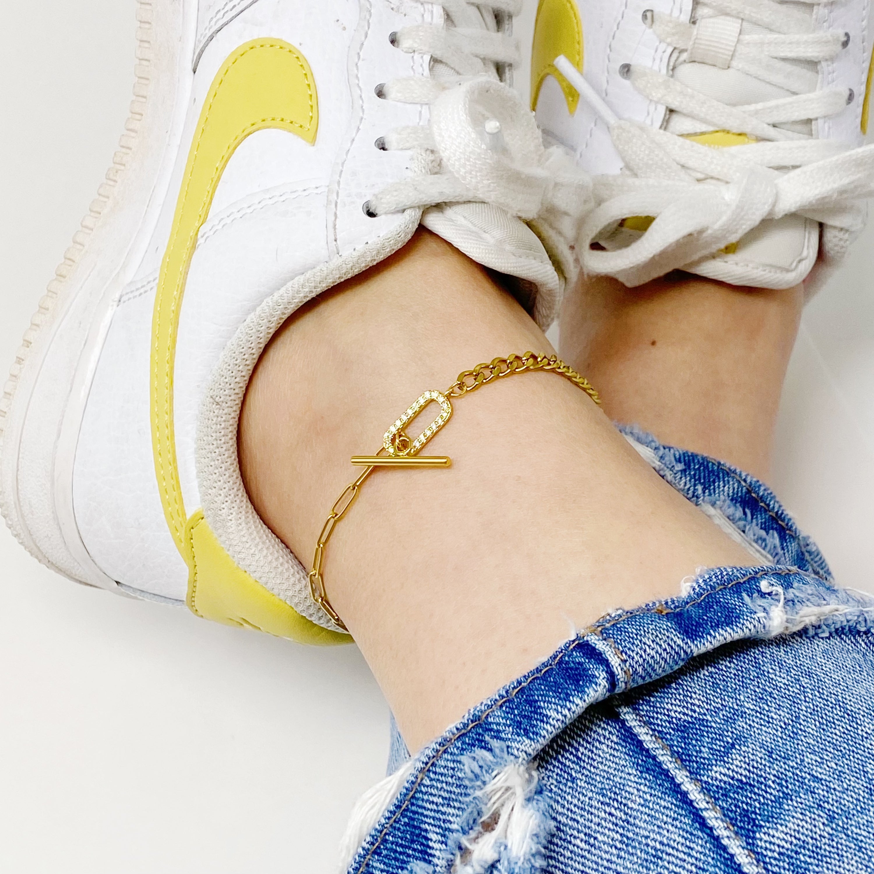 A stylish Mixed Chain Glam Toggle Anklet featuring two different chains and a cubic zirconia toggle closure, perfect for any occasion.