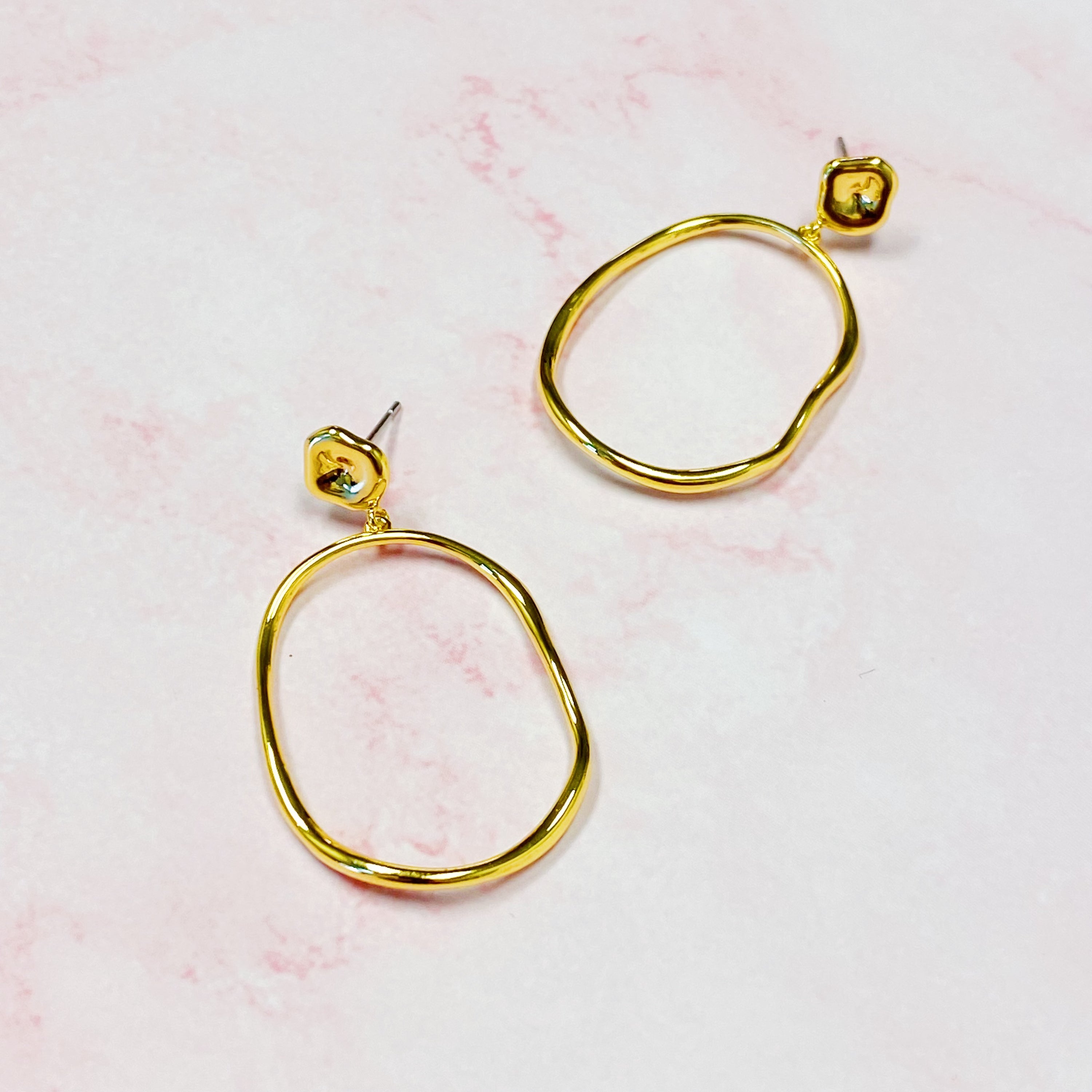 Stylish Modern Molten Oval Drop Earrings in 18K gold plated brass, featuring a chic dangling design.