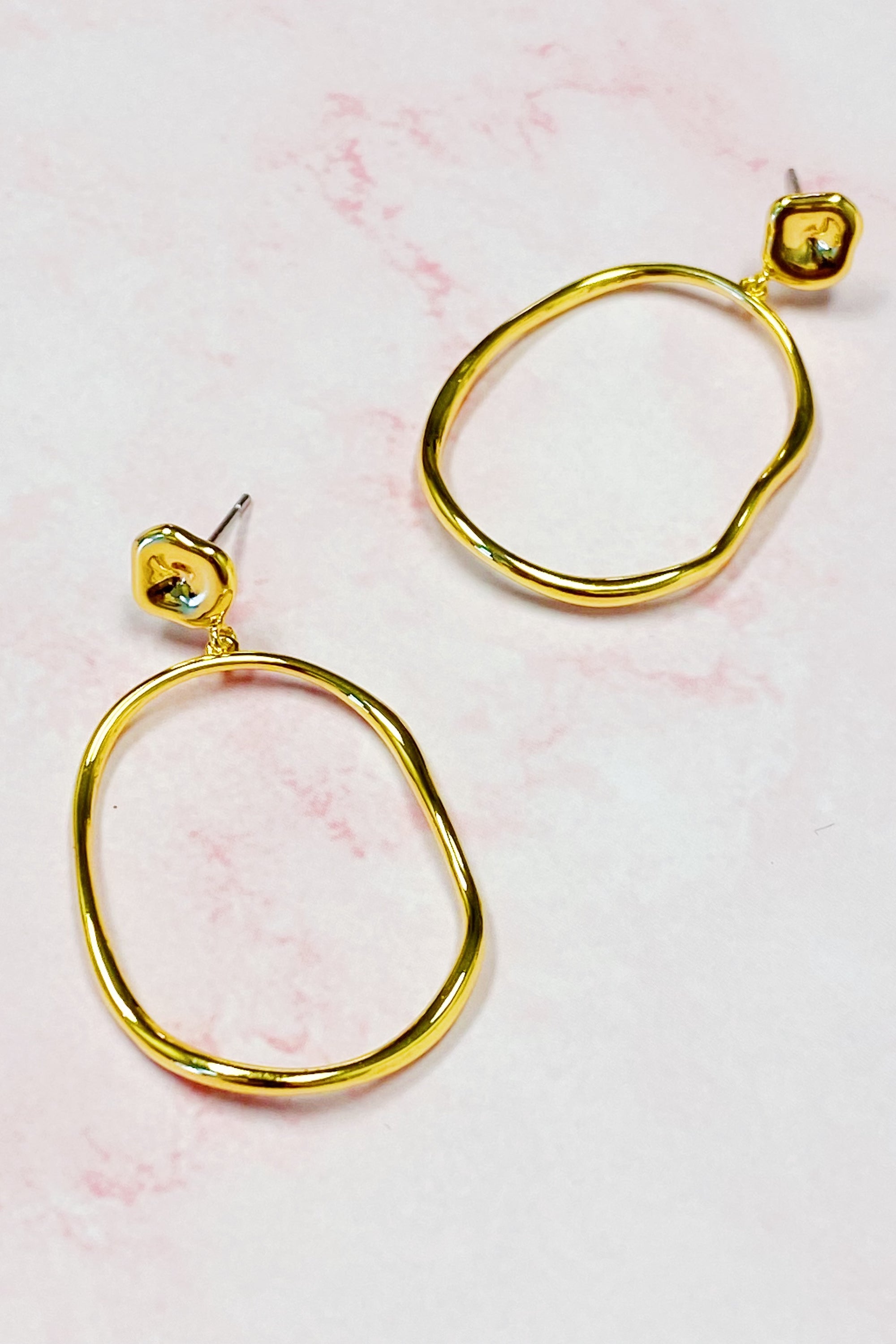 Stylish Modern Molten Oval Drop Earrings in 18K gold plated brass, featuring a chic dangling design.