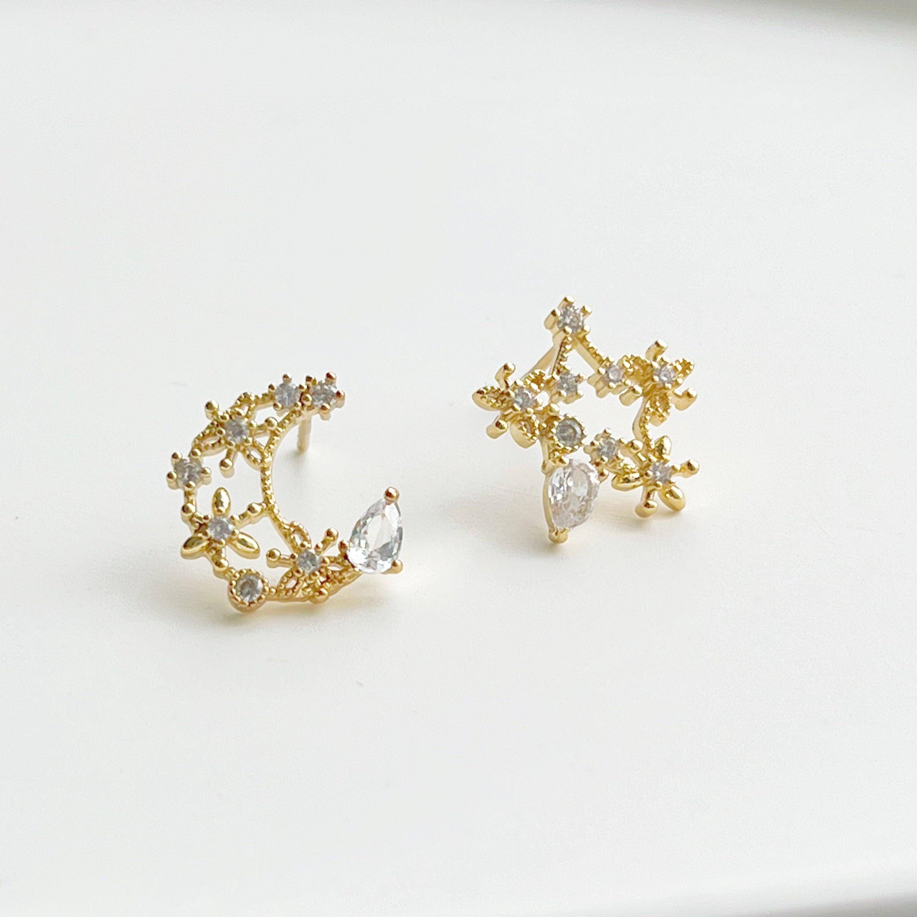 Elegant Moon and Star Earrings featuring teardrop crystals in gold, crafted from sterling silver and gold plated bronze.
