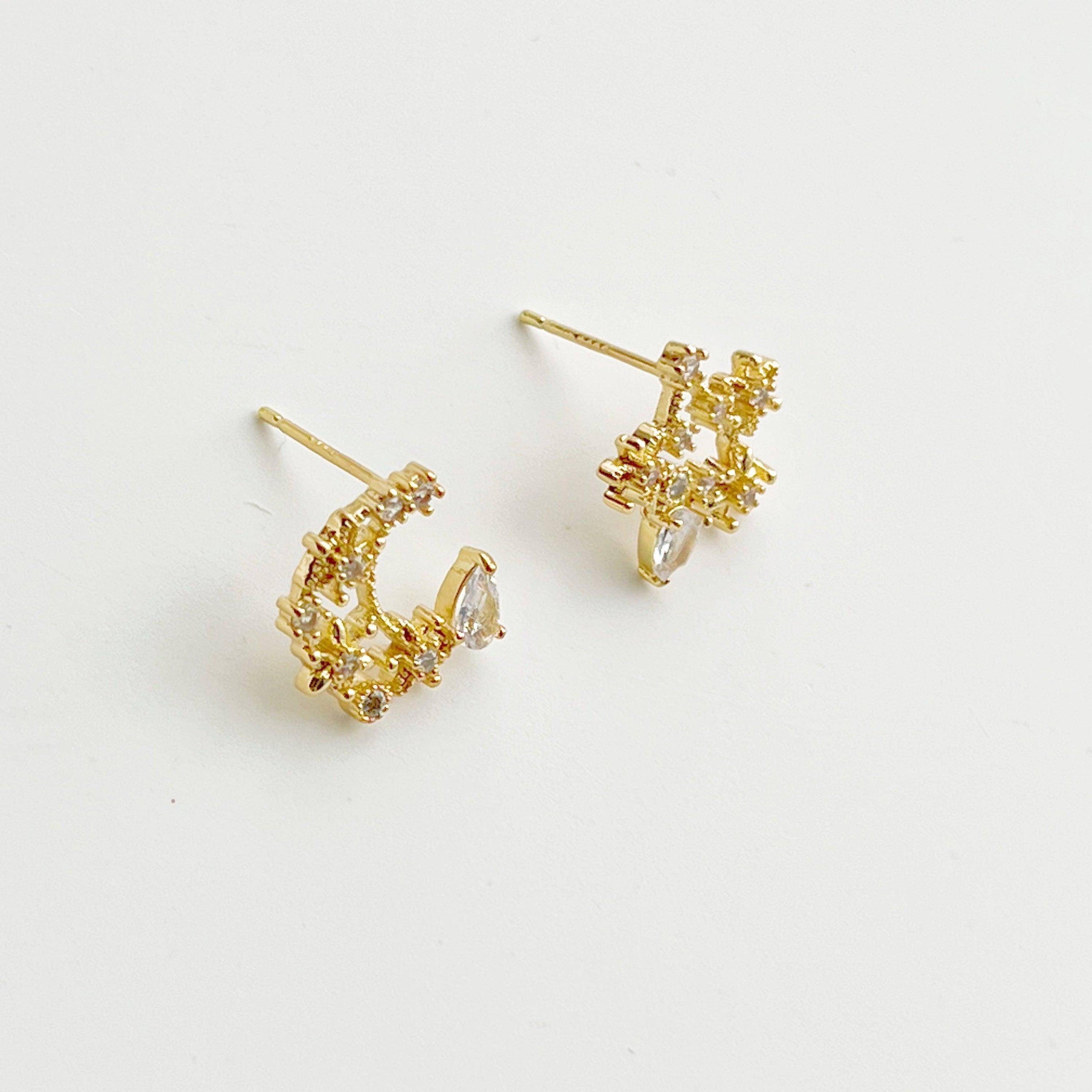 Elegant Moon and Star Earrings featuring teardrop crystals, crafted from sterling silver and silver-plated bronze.