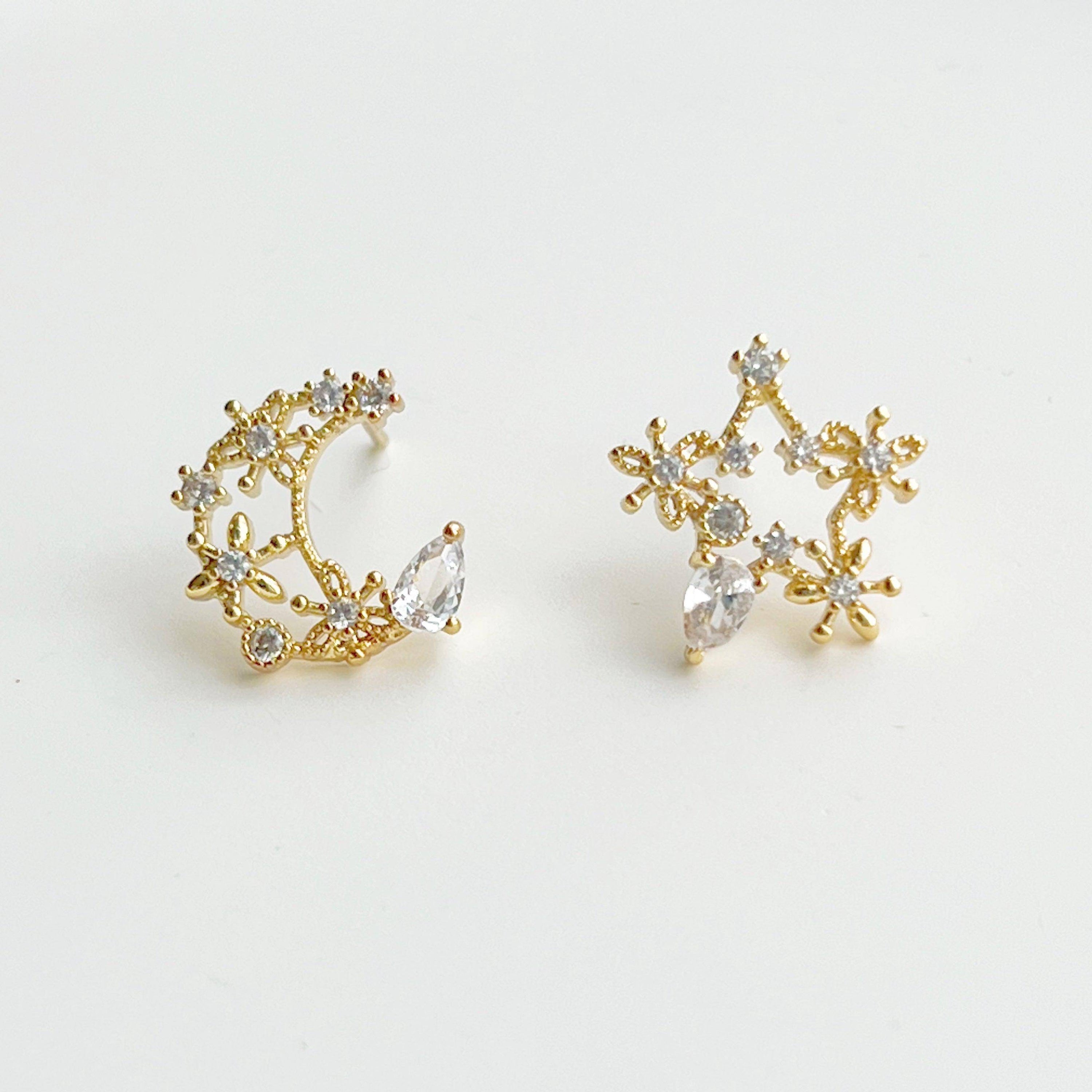 Elegant Moon and Star Earrings featuring teardrop crystals, crafted from sterling silver and silver-plated bronze.