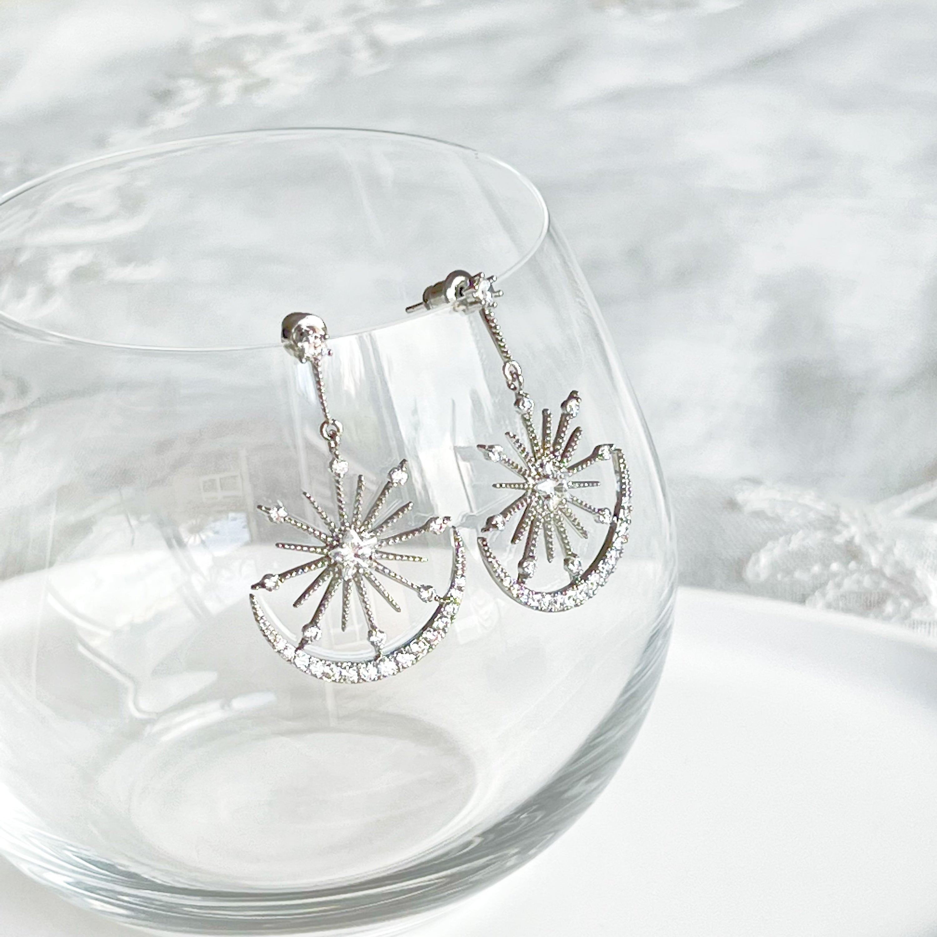 Moon and Stars Silver Drop Earrings featuring sterling silver studs and clear zircon embellishments, elegantly designed for a celestial look.