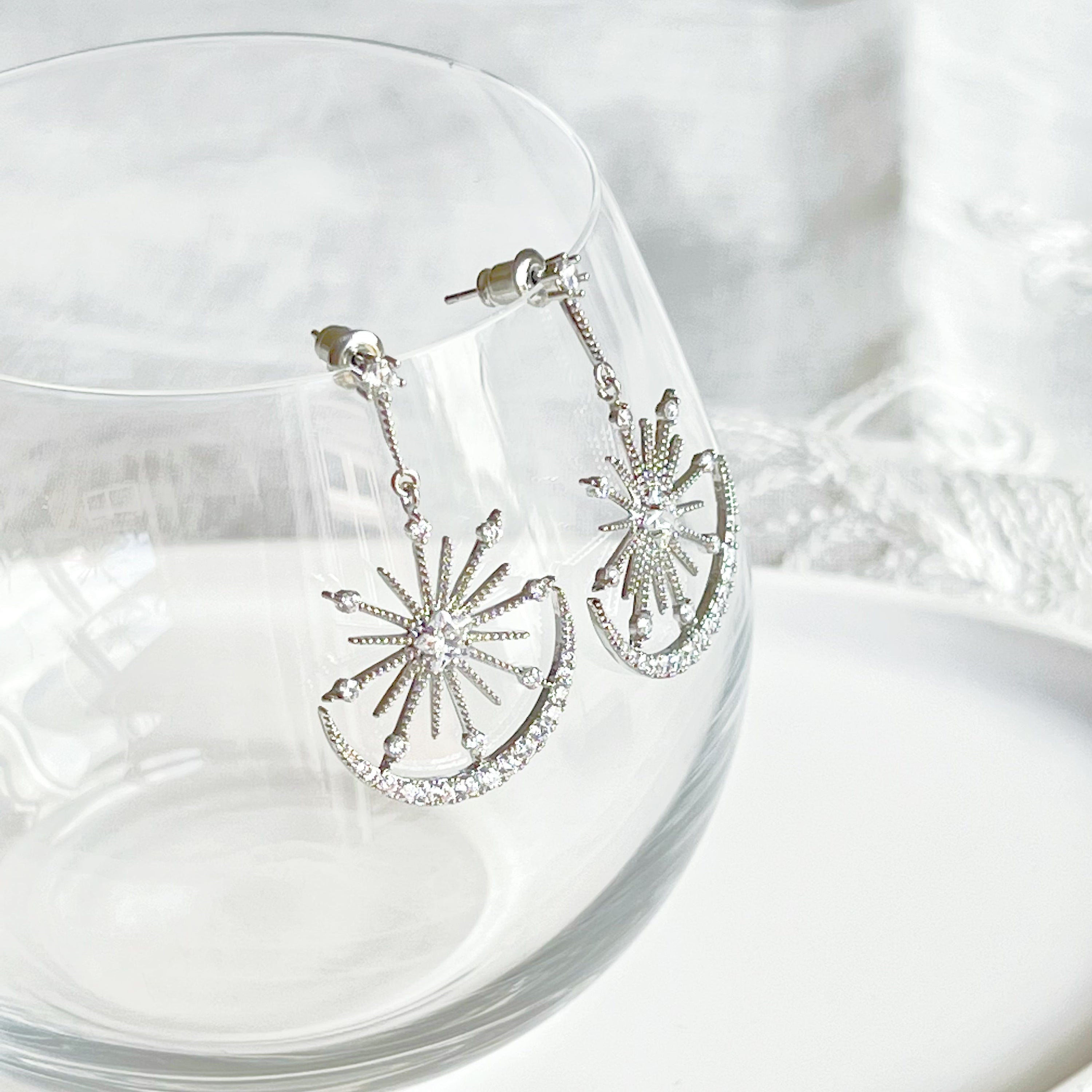 Moon and Stars Silver Drop Earrings featuring sterling silver studs and clear zircon embellishments, elegantly designed for a celestial look.