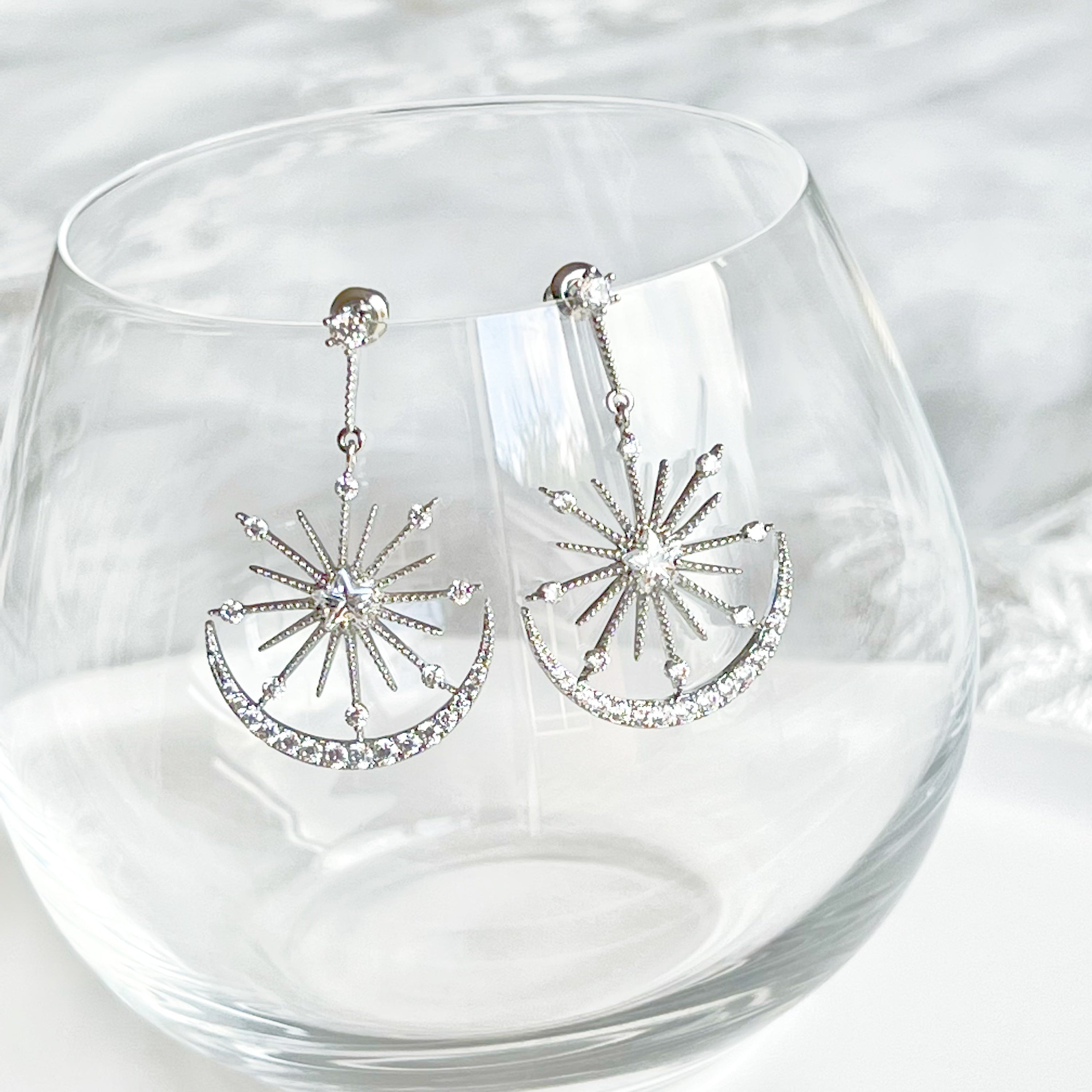 Moon and Stars Silver Drop Earrings featuring sterling silver studs and clear zircon embellishments, elegantly designed for a celestial look.
