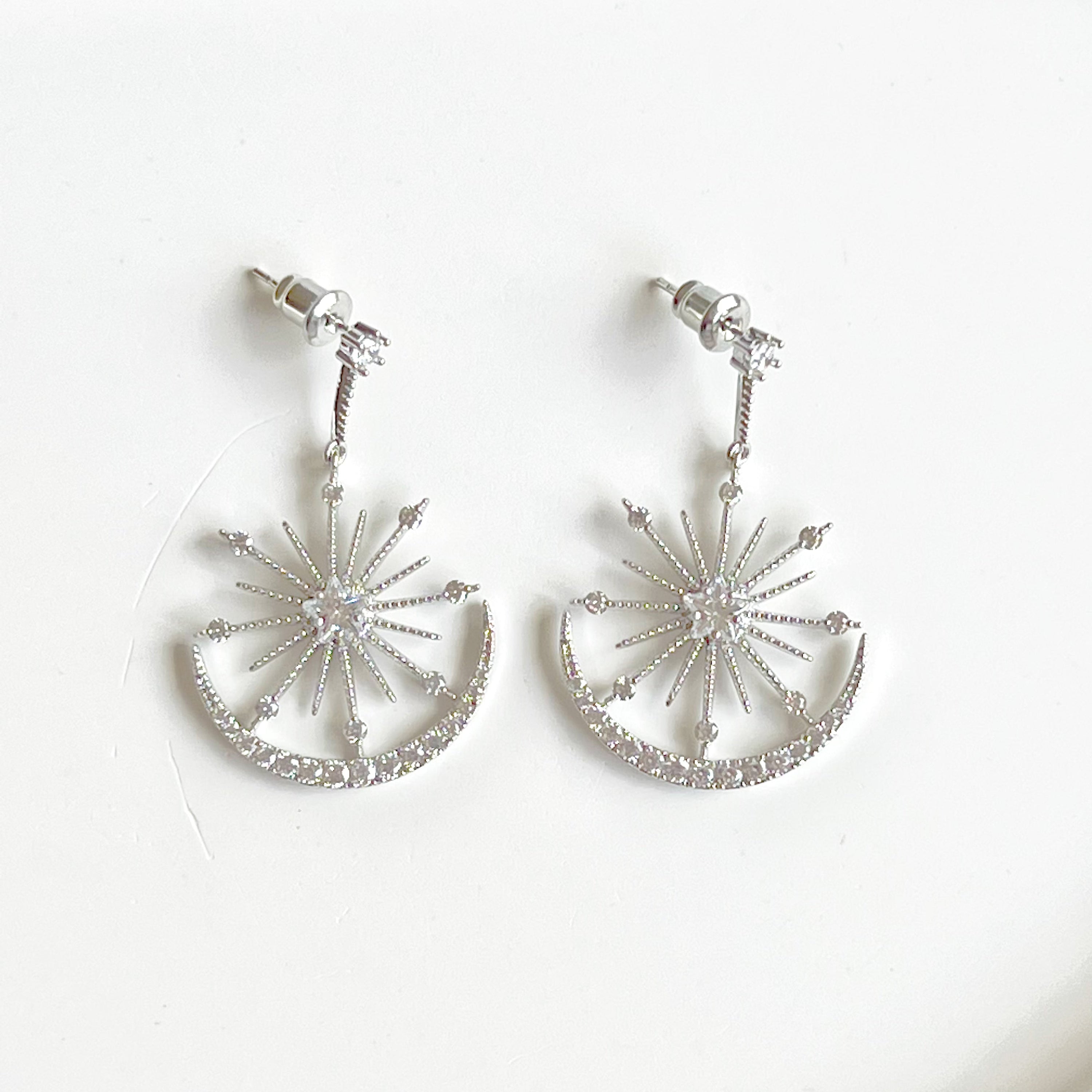 Moon and Stars Silver Drop Earrings featuring sterling silver studs and clear zircon embellishments, elegantly designed for a celestial look.