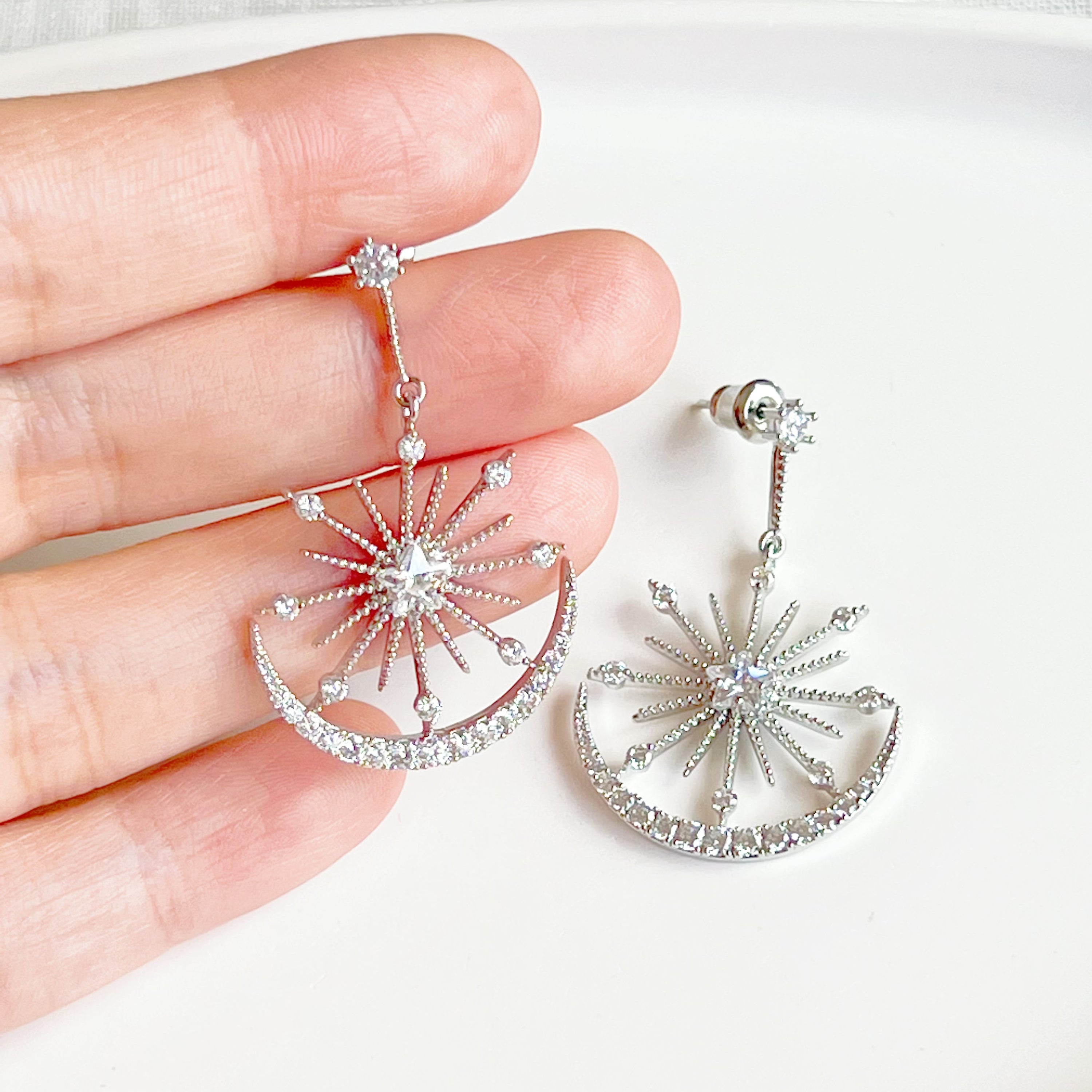 Moon and Stars Silver Drop Earrings featuring sterling silver studs and clear zircon embellishments, elegantly designed for a celestial look.