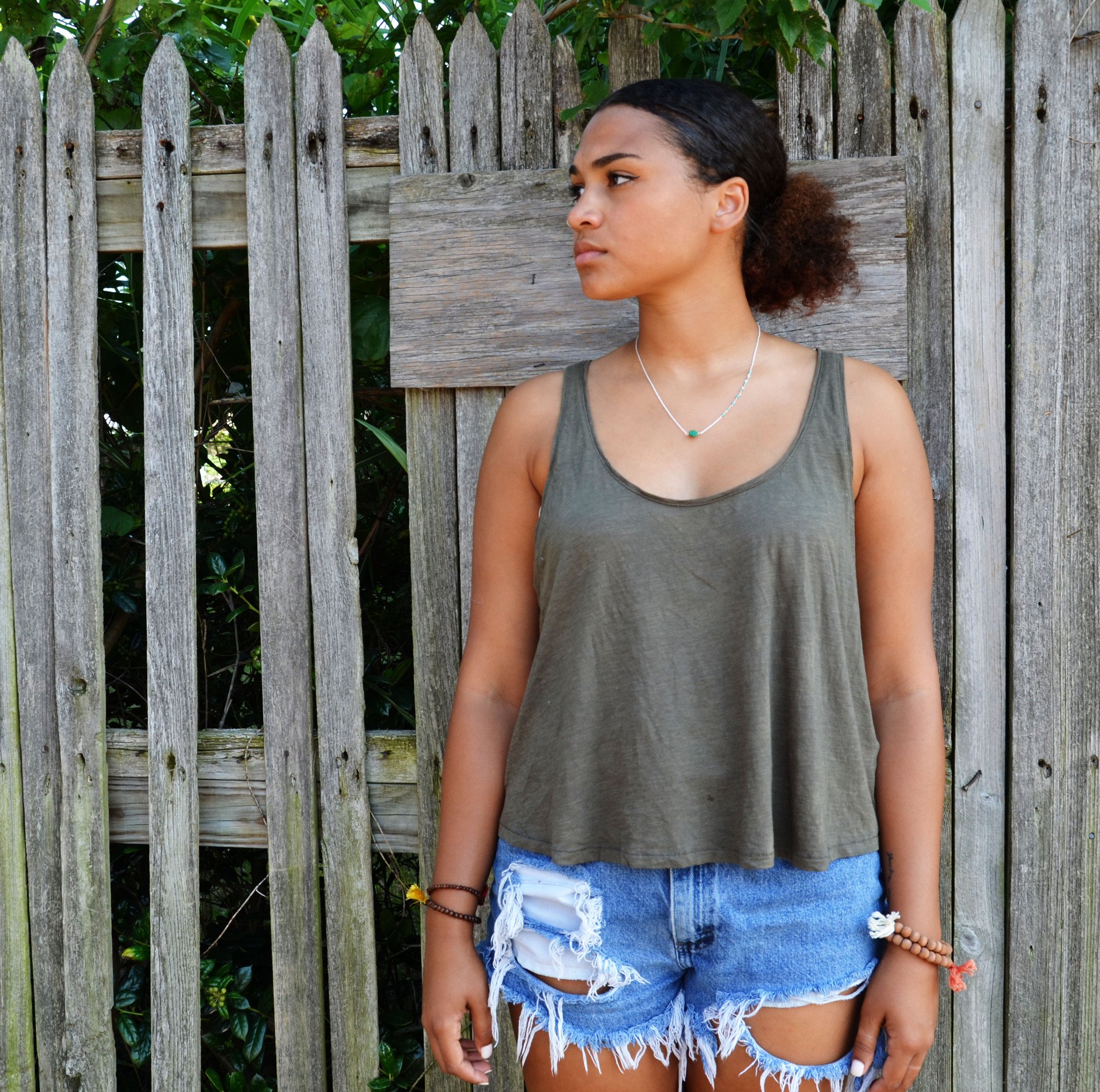 Moon Drop Pendant featuring wood beads, sterling silver, and gold plating on an 18-inch chain, showcasing unique artisan craftsmanship.