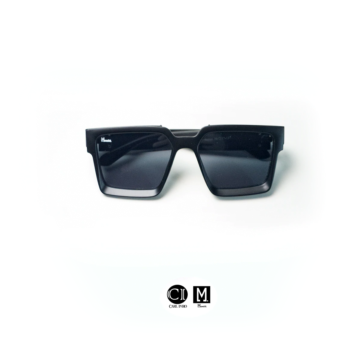 Monett Manifesto Black sunglasses featuring a stylish square frame and gradient lenses, perfect for outdoor activities.