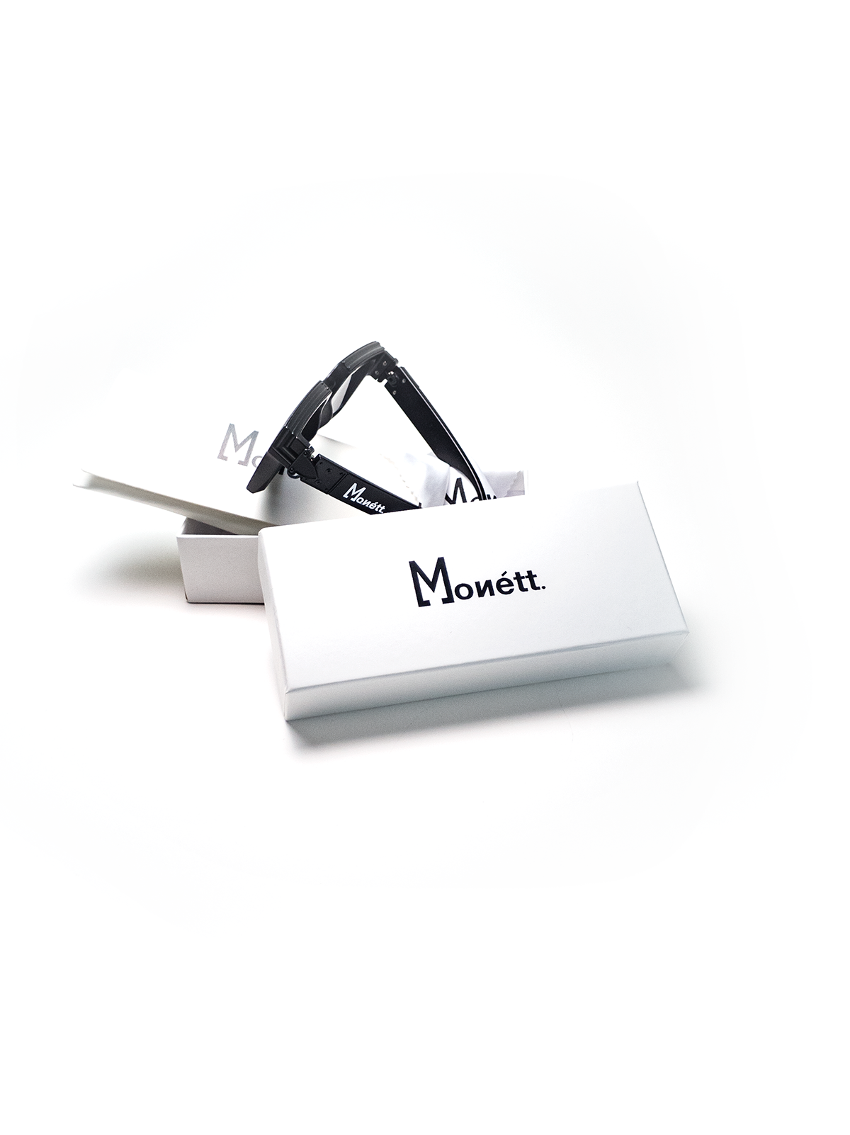 Monett Manifesto Black sunglasses featuring a stylish square frame and gradient lenses, perfect for outdoor activities.