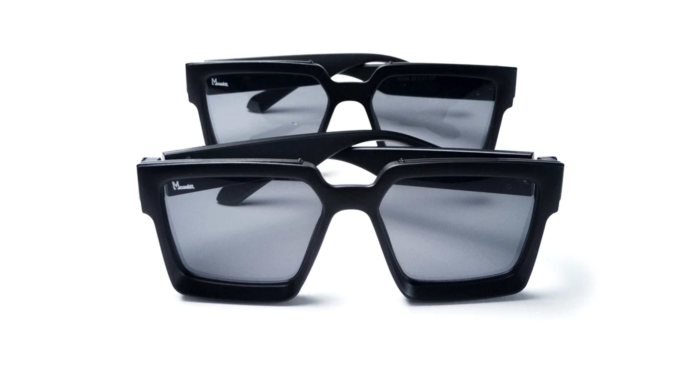 Monett Manifesto Black sunglasses featuring a stylish square frame and gradient lenses, perfect for outdoor activities.