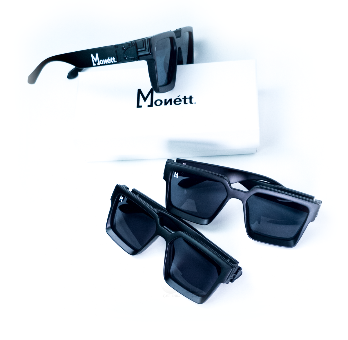 Monett Manifesto Black sunglasses featuring a stylish square frame and gradient lenses, perfect for outdoor activities.