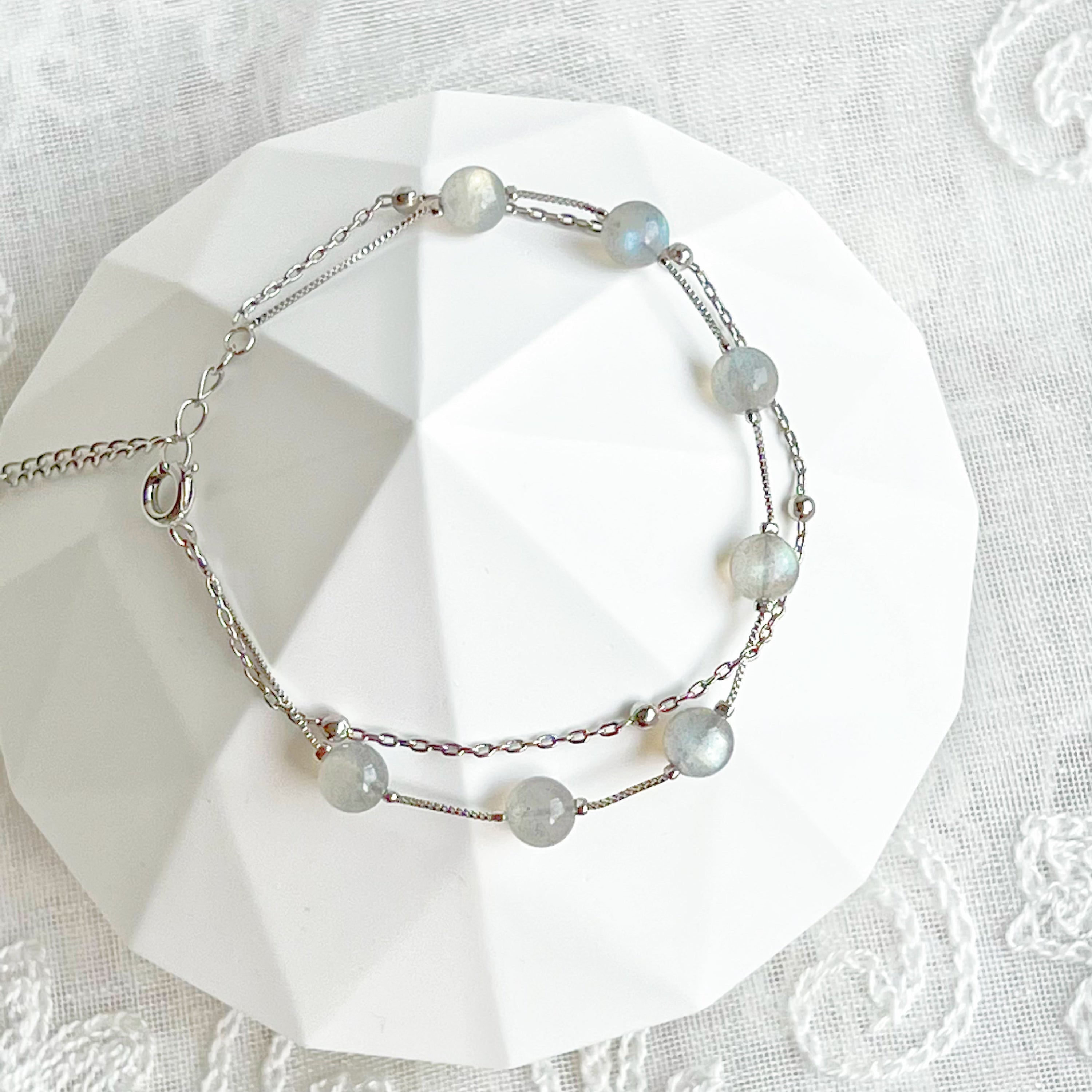 Moonstone Silver Double Chain Bracelet featuring 6mm moonstone beads and silver plated bronze chain, elegantly displayed.
