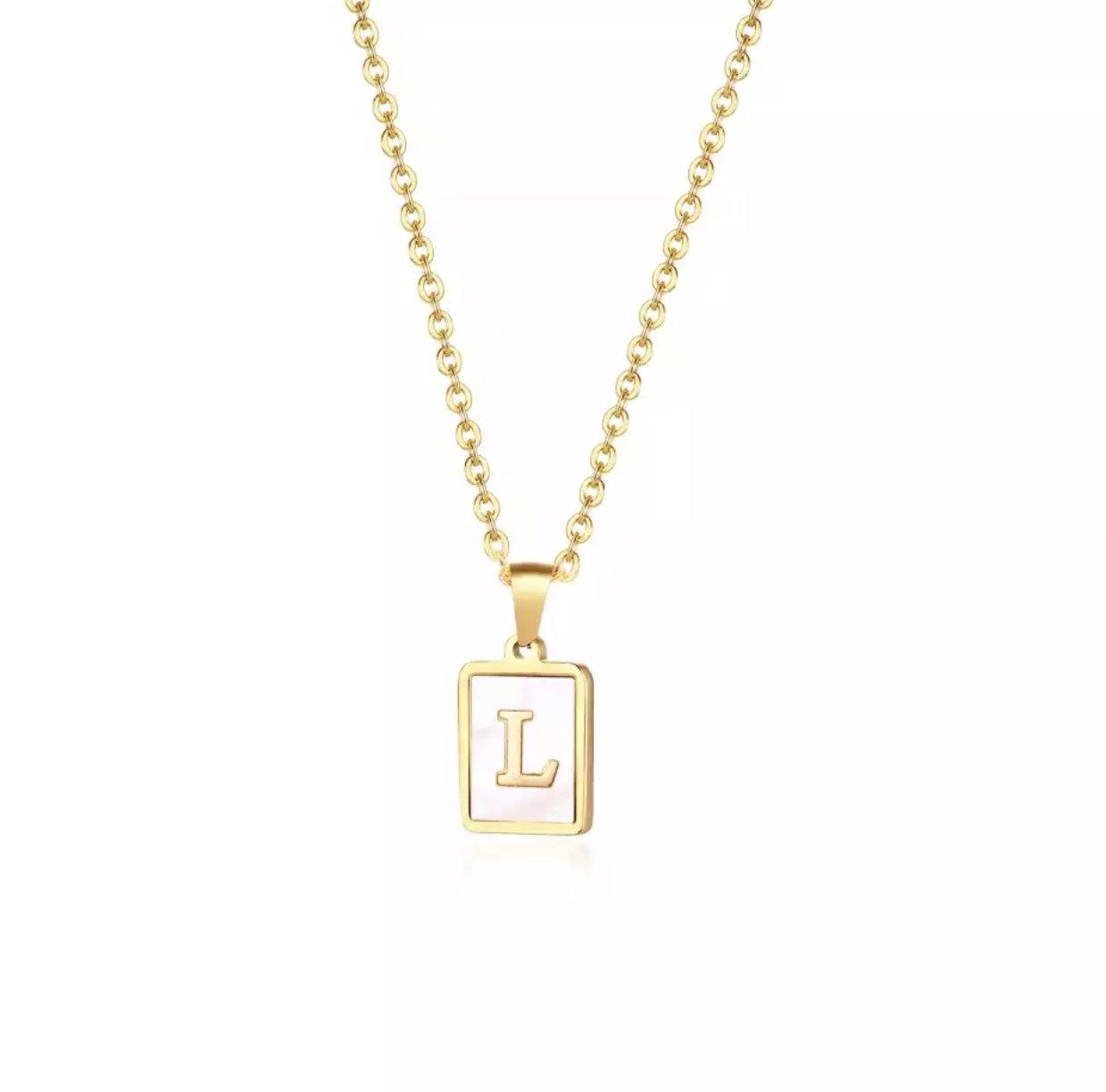 A stylish gold plated necklace featuring a mother of pearl shell pendant, perfect for modern outfits and thoughtful gifts.