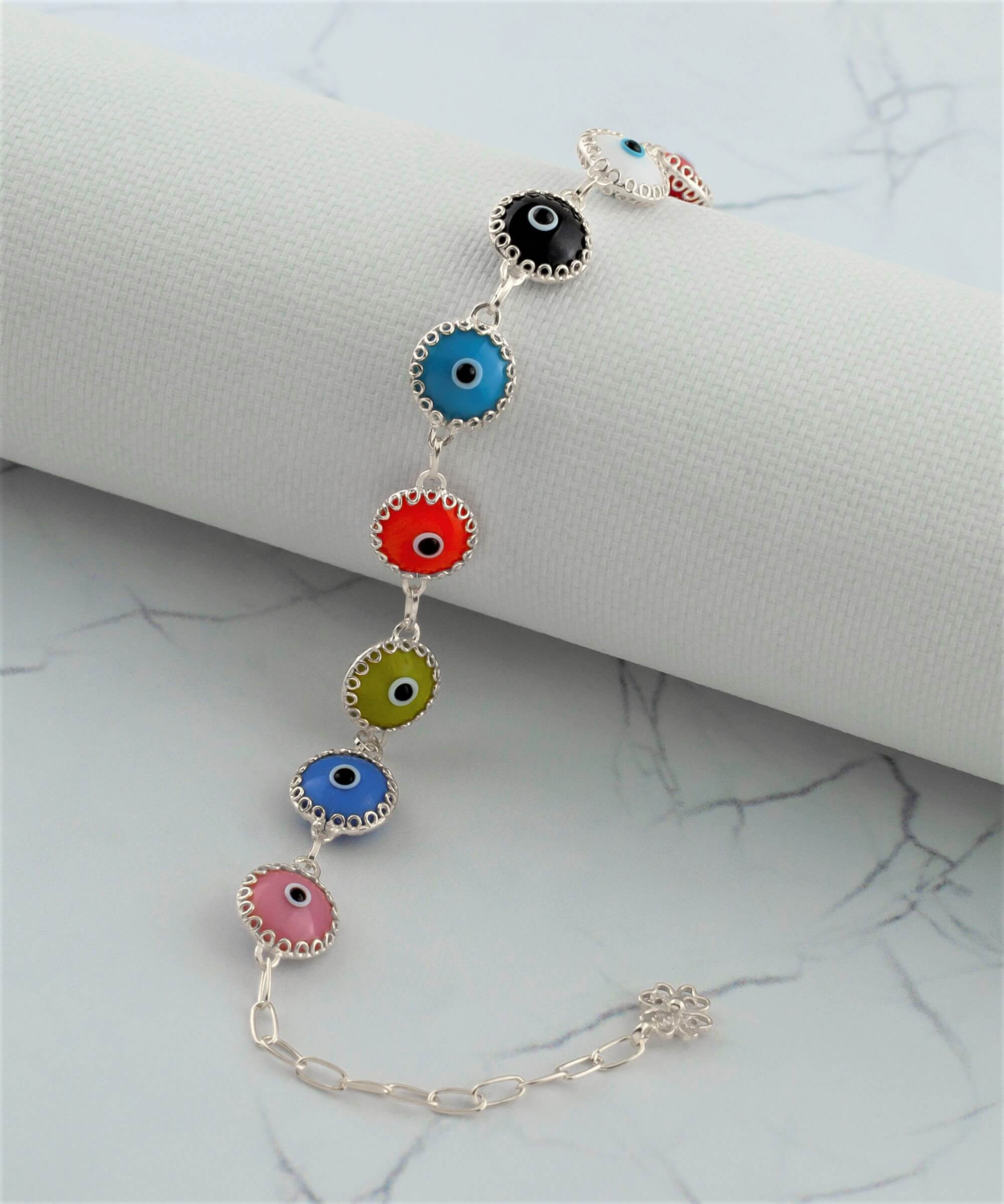 Multi Color Evil Eye Sterling Silver Adjustable Link Bracelet featuring multicolor beads and a strong rolo chain, secured with a lobster claw clasp.