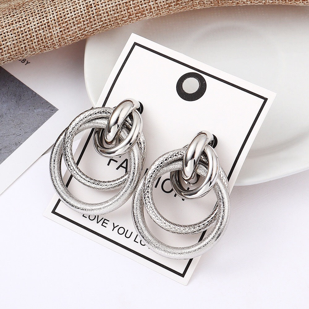 Multi hoop earrings featuring a unique snake pattern, crafted from alloy and steel, measuring 4.5cm in length.
