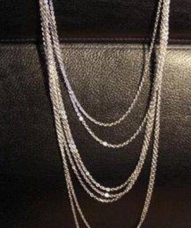 A stylish multi-layer chains necklace made of alloy and adorned with rhinestones, showcasing its elegant design.