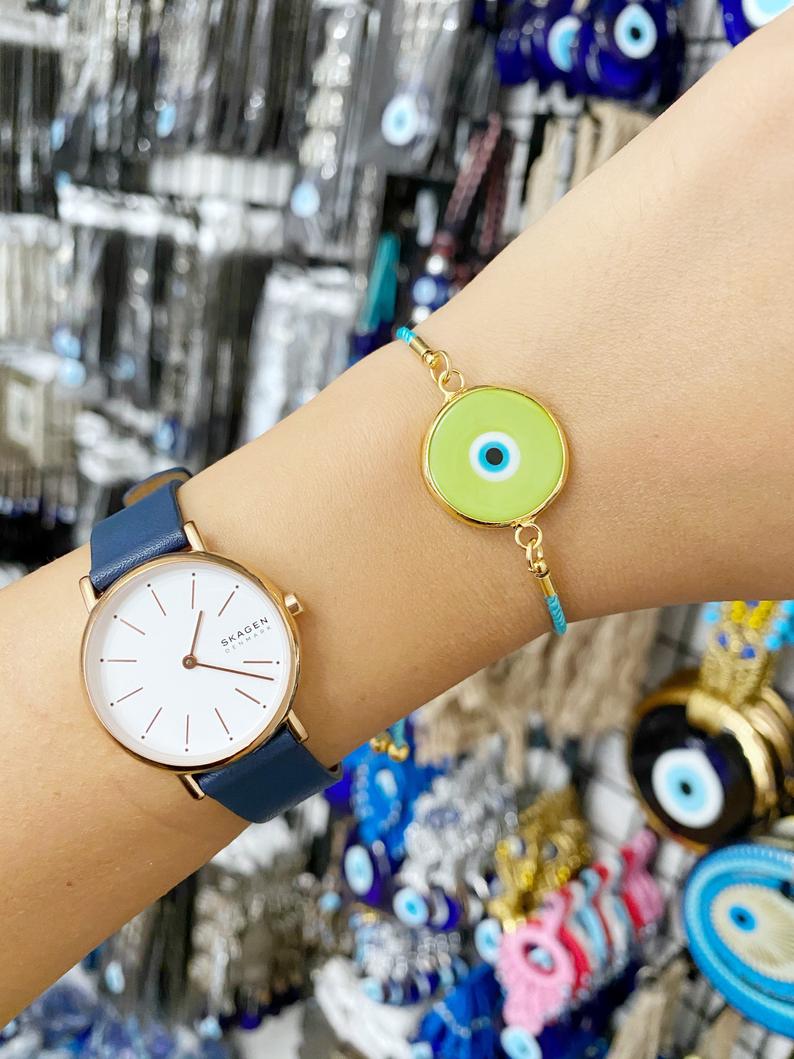 Murano Evil Eye Bracelet featuring a green Murano bead on an adjustable cord, showcasing its handmade craftsmanship and elegant design.