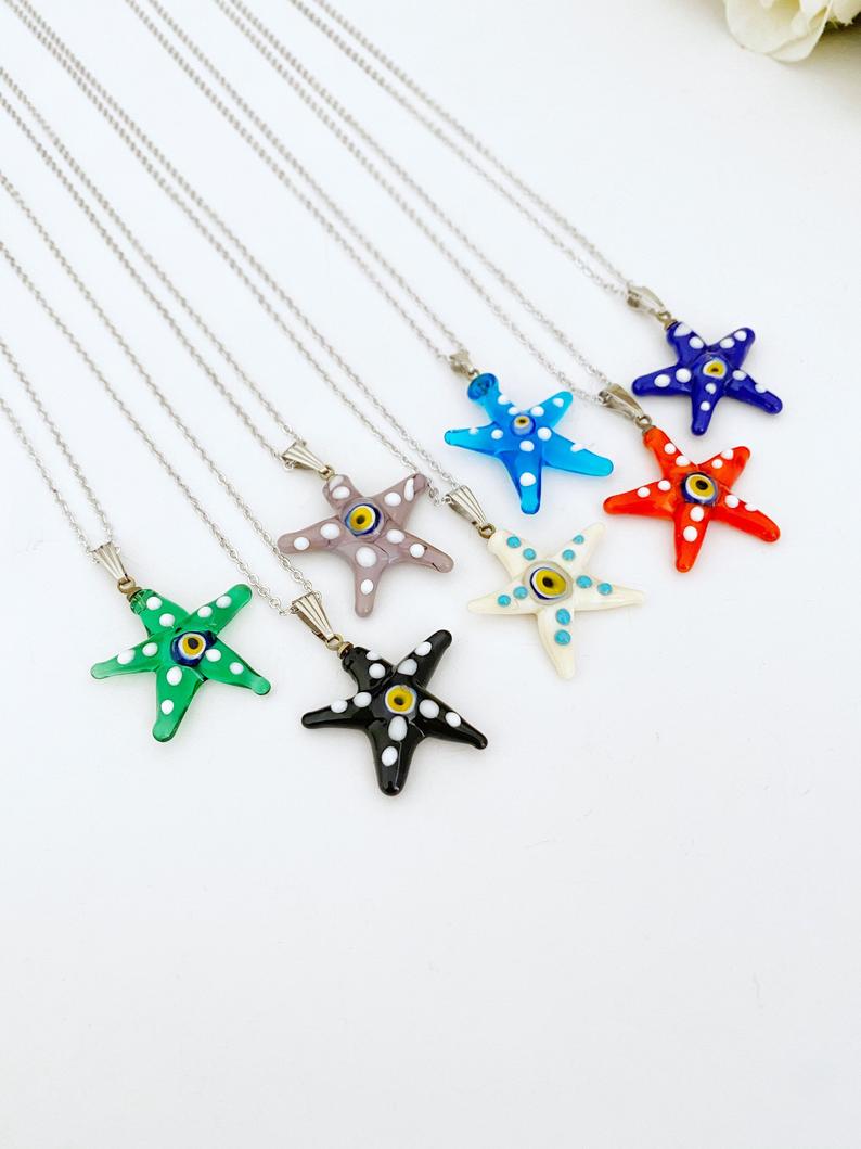 Murano Evil Eye Necklace featuring a handmade glass starfish pendant in vibrant colors, set on a stainless steel gold chain.