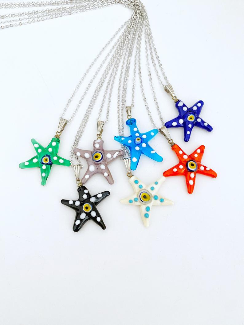 Murano Evil Eye Necklace featuring a handmade glass starfish pendant in vibrant colors, set on a stainless steel gold chain.