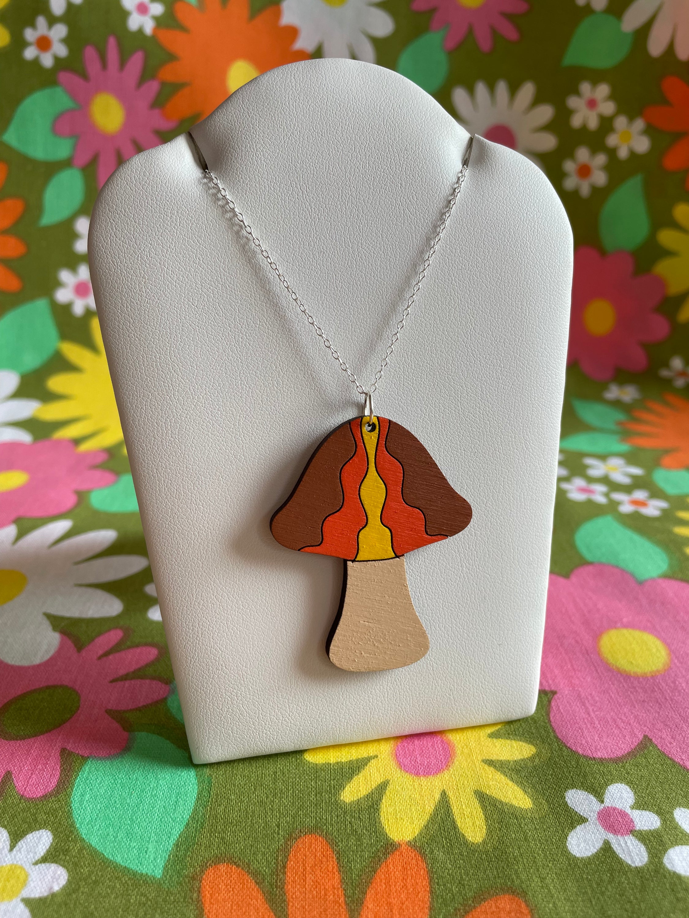 A stylish Mushroom Necklace: Waves made from laser-cut Birch Plywood, featuring a unique mushroom design on a sterling silver chain.
