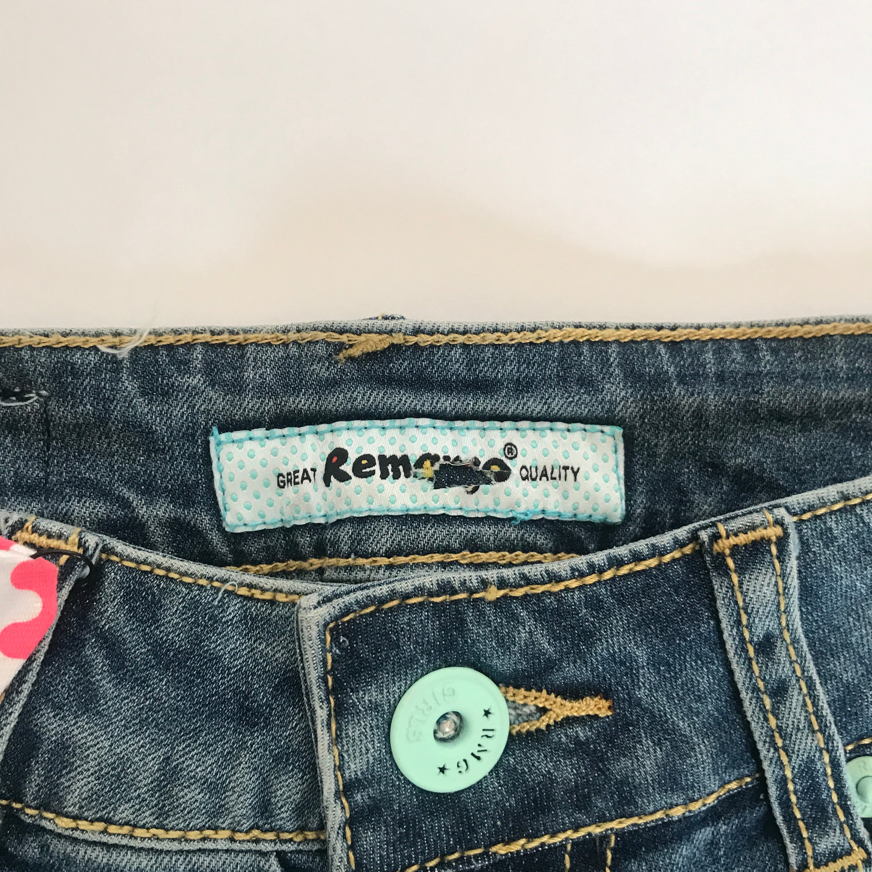 A pair of stylish denim shorts featuring a unique music notes design, made from a comfortable cotton and spandex blend.