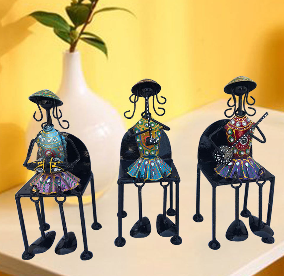 Set of 3 Musical Girls Legs Hanging Figurines made of wrought iron, showcasing elegant tribal girls sitting on chairs.