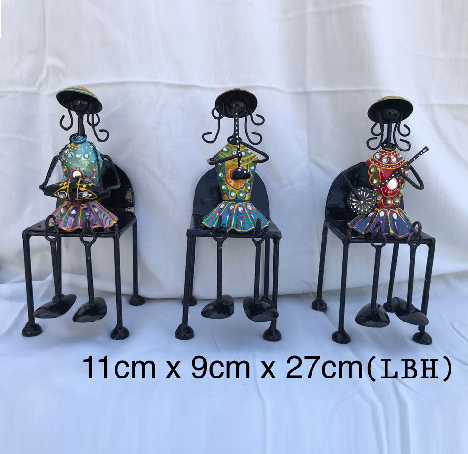 Set of 3 Musical Girls Legs Hanging Figurines made of wrought iron, showcasing elegant tribal girls sitting on chairs.
