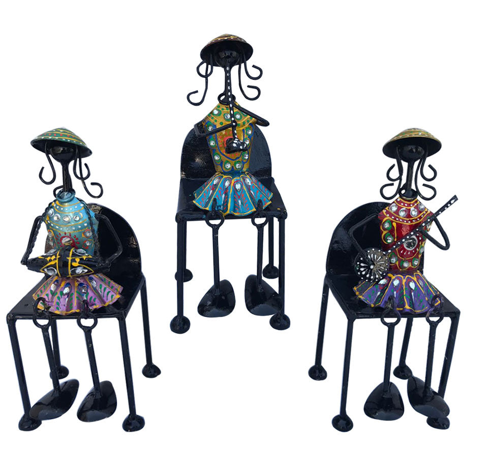 Set of 3 Musical Girls Legs Hanging Figurines made of wrought iron, showcasing elegant tribal girls sitting on chairs.