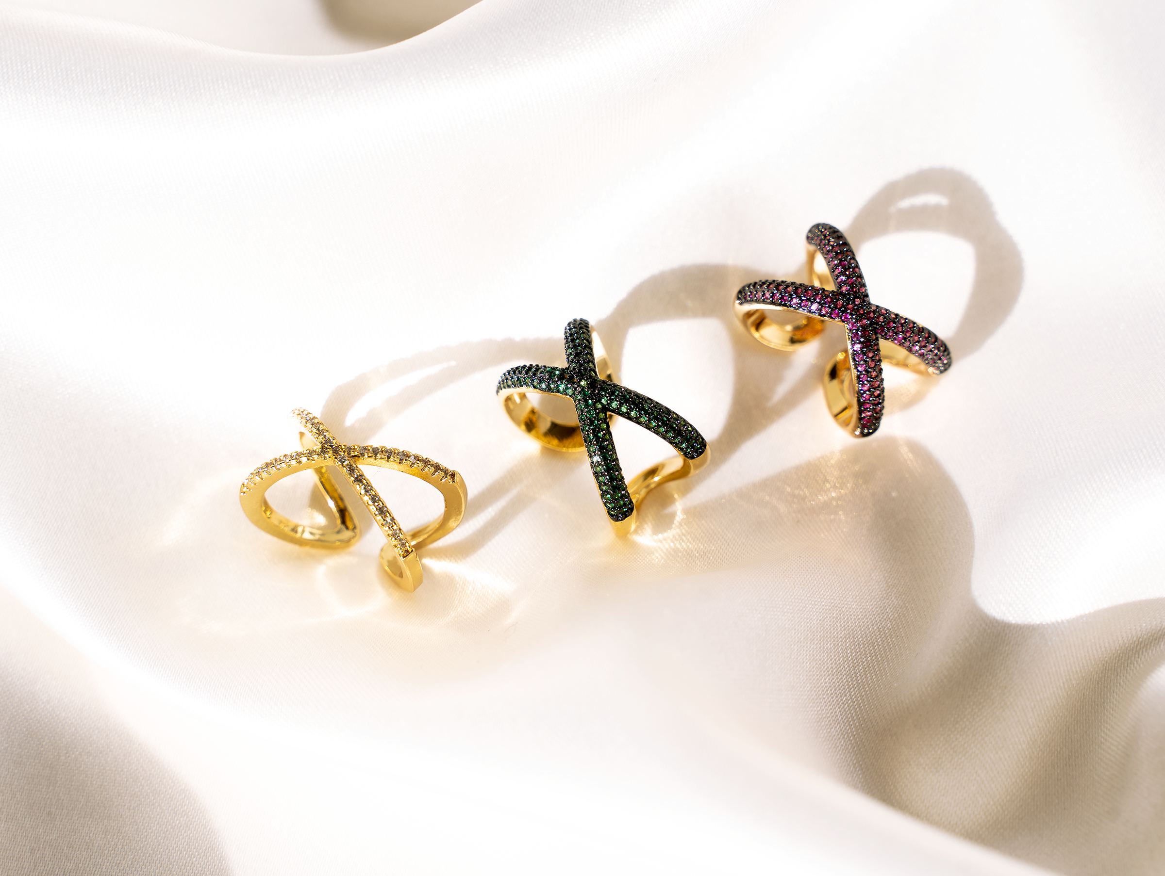 MYLA Ring featuring an x-shaped cuff design with colorful cubic zirconia stones in a pave setting, elegantly polished in 14K gold plating.